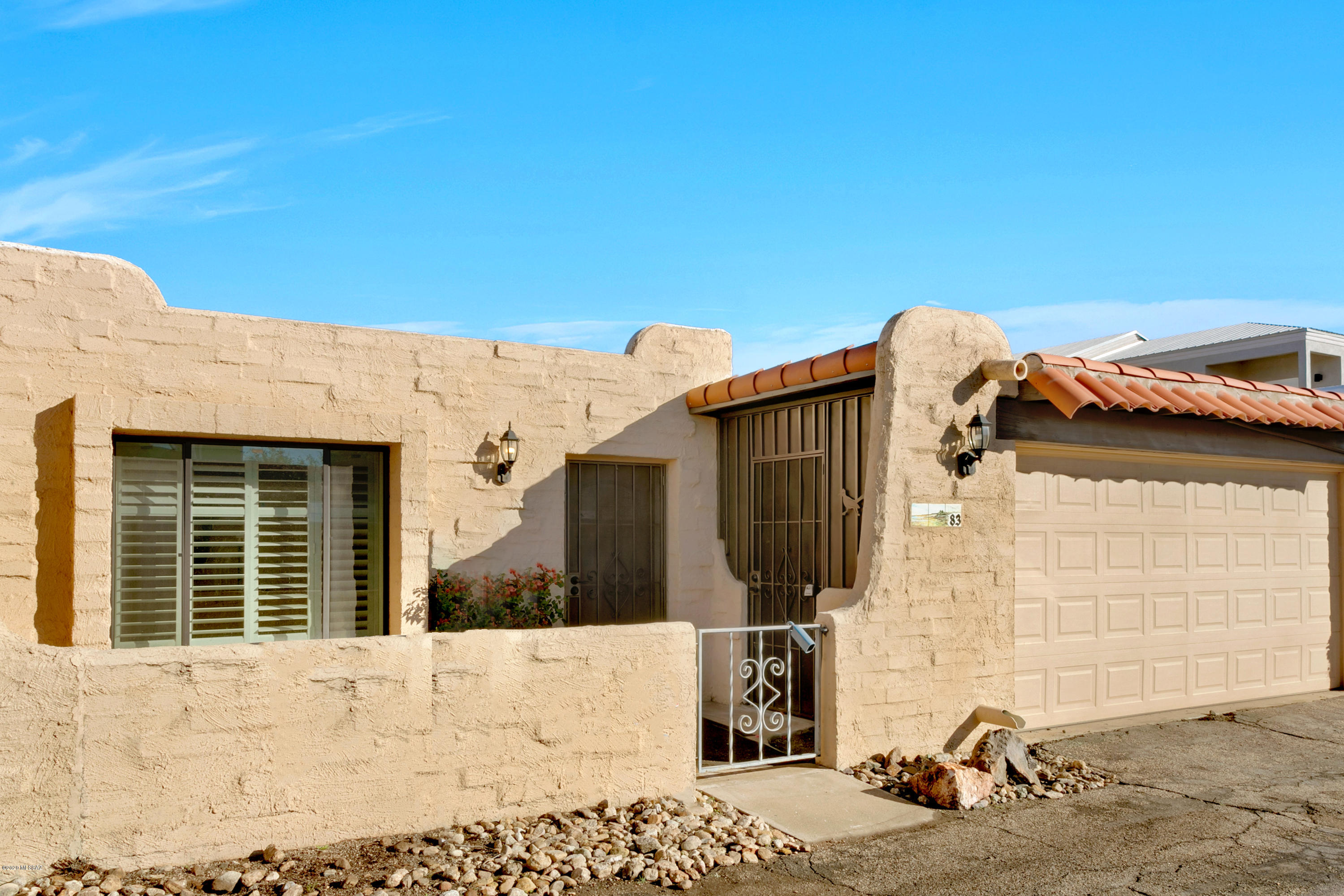 Corner units are so nice - tons of yard space and mountain views too!  With tile throughout, this 3 bed/2 bath home is ready for your final touches! Close to shops and restaurants, you'll love this location.  And with a large laundry room and 2 car garage, storage is easy!  Community pool too!