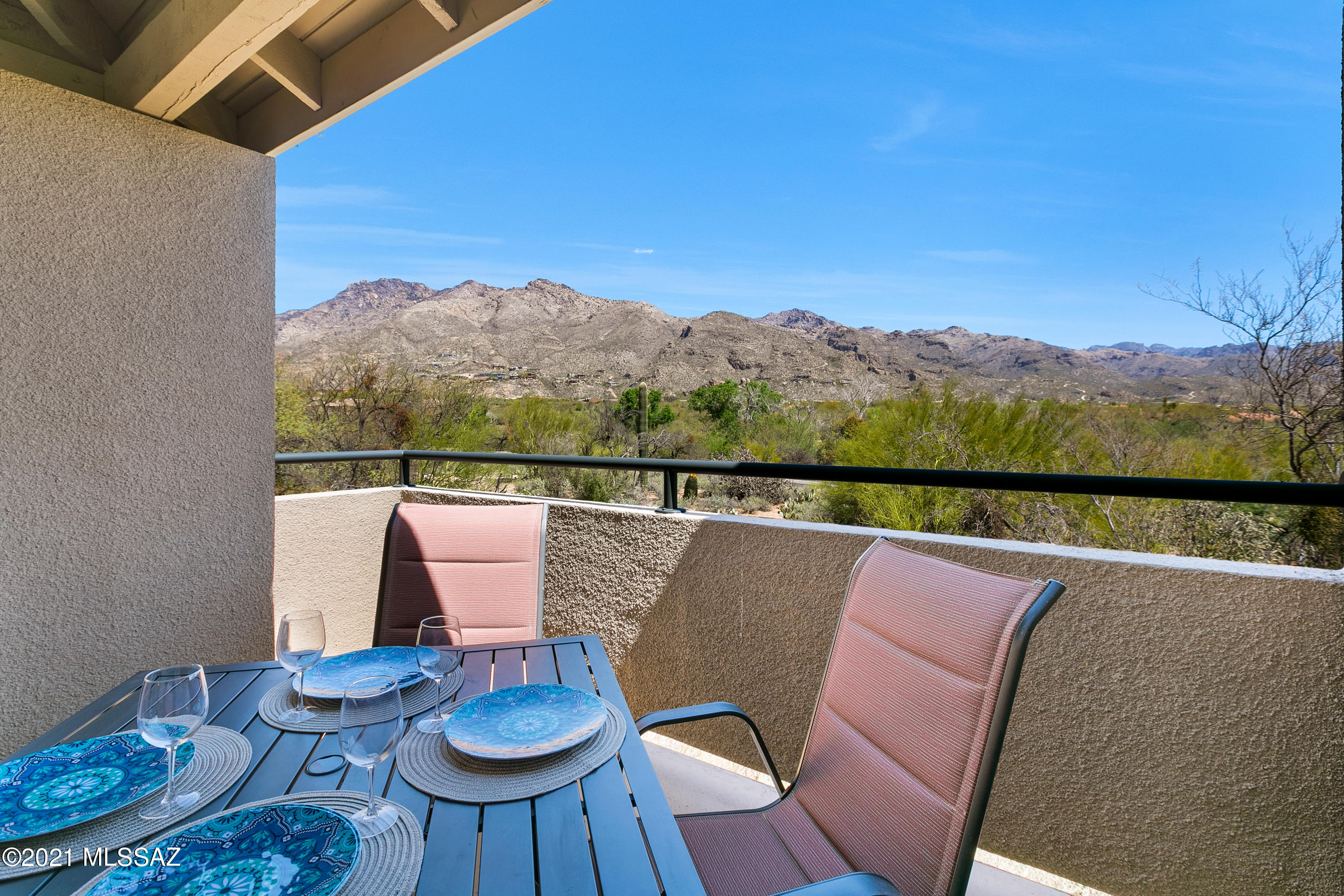 Updated Catalina Foothills condo with STUNNING panoramic mountain views from the patio, living room, and master! This beautiful upstairs unit features wood floors throughout the living area, ceramic tile in the kitchen and bath and carpet in both bedrooms. This unit is located right by the main pool and fitness center. Open living area and walk-in laundry room. The spacious covered patio allows you to enjoy the beautiful AZ weather and VIEWS! Additional storage off balcony. This coveted community offers 3 pools and 2 spas, workout center, business center, and a full time on-site manager. No minimum lease restrictions- nightly rentals allowed!  Close ride or walk to golfing, hiking, multiple restaurants and shops and the Lowe's Ventana Canyon Resort and Spa.  Live the life of luxury!