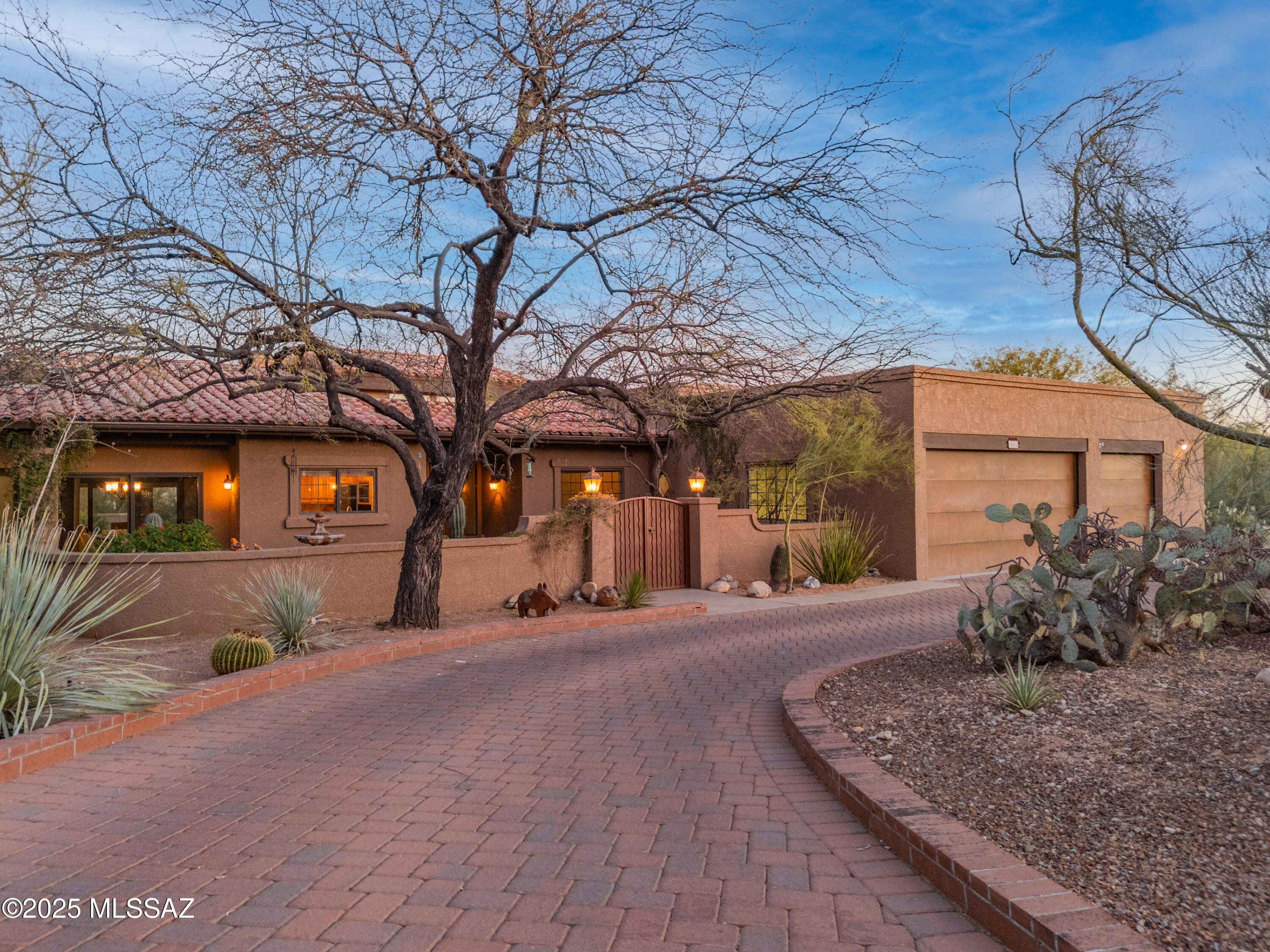 Property owner is a licensed realtor in Arizona. 

Welcome to this stunning Southwestern-style home offering 5 bedrooms and 3 beautifully appointed bathrooms. Timeless granite countertops grace the kitchen and bathrooms, while wood flooring paired with Spanish tile create a seamless, stylish look. 

As you enter, you are greeted by a charming gated porch with a peaceful water fountain setting the tone for the inviting atmosphere within. The living areas boast high ceilings with exposed wood beams, adding character and warmth. The dual-sided fireplace warms both the formal living room and family room, creating a cozy ambiance. The kitchen features an island and stainless steel appliances, making it perfect for both cooking and entertaining. 

Step outside to a backyard retreat with a built-in BBQ and sparkling pool - ideal for Arizona's sunny days. The 3-car garage offers plenty of storage, and the owned solar system ensures energy efficiency and savings. 

Located in the desirable Shadow Hills neighborhood of Catalina Foothills, this home is close to shopping, restaurants, art galleries, hiking trails, and easy access to "The Loop" for cyclists. The University of Arizona is just 15 minutes away, and Downtown Tucson is under 20 minutes. 

With stunning mountain views visible throughout, this home blends Southwestern design with modern comfort, offering the perfect setting for both indoor relaxation and outdoor enjoyment.