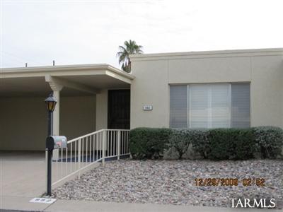 This charming townhome features spacious rooms, hardwood floors and tile through-out. Dining area and functional kitchen space. Patio courtyard and small back yard. Carport with two spaces. AC and great location.
