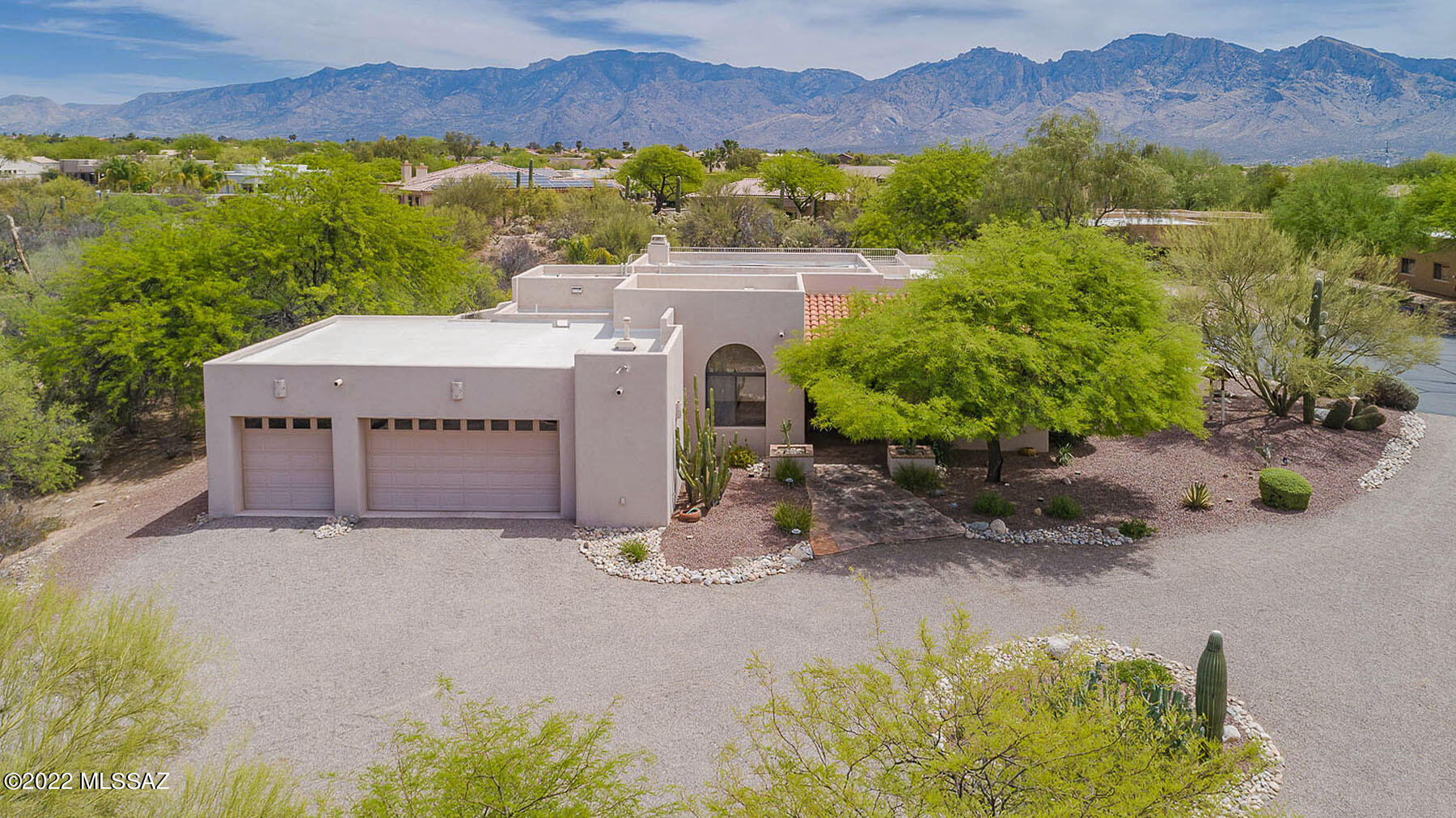 Spectacular 4BD/3BA (2,628 sq ft) estate situated on a private 3.4 acre cul-de-sac lot boasts resort-style living and mountain views. Dramatic living room is highlighted by a soaring wood beam ceiling, corner fireplace and built-in media center w/surround sound. Dining area features built-in credenza. Expansive chef's kitchen hosts breakfast island, built-in appliances, workstation w/desk and dining nook. Charming owner's suite w/patio access offers a luxury bath w/jetted tub, glass block shower and dual vanities. Second bedroom can double as office. Amenities galore including skylights, wired sound, central vac, alarm, water filtration, 3-car garage. Tranquil rear yard boasts a covered patio, solar heated pool, spa, shaded lawn plus full staircase to upper deck with awe-inspiring views.
