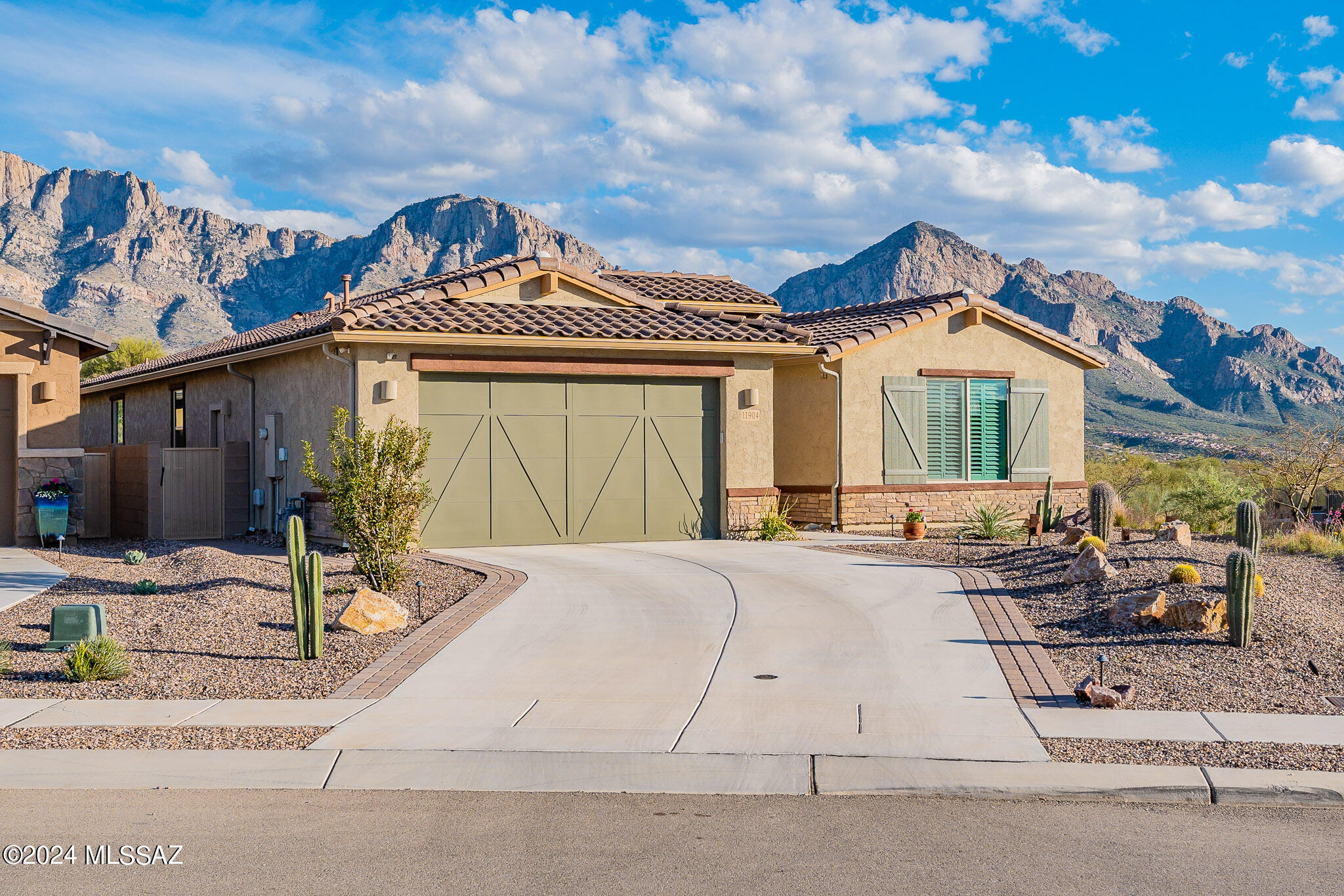 Enjoy picturesque views of the Catalina Mtns/Pusch Ridge! Corner lot on a cul-de-sac borders common area w/only neighbors on one side! Enter into a long, tiled entry, w/2BR & a flex room toward front & primary at the back for a split BR plan! Open kitchen/great room are spacious & inviting w/dining nook & breakfast bar island. Quartz counters enhance the 2-toned gray island cabinets & white 42'' cabinets on wall, along w/2 glass door cabinets. Gas cooktop, wall oven & microwave for the chef, refrigerator stays too. Wi-Fi mesh/smart panel. Whole home Humidifier. Save the best for last - the backyard! Cov'd patio to enjoy the mtns. Saltwater spa for evening relaxation. Gas firepit on raised patio to enjoy w/guests. Outdoor kitchen for entertaining meals! (sink, fridge, grill, bar counter)