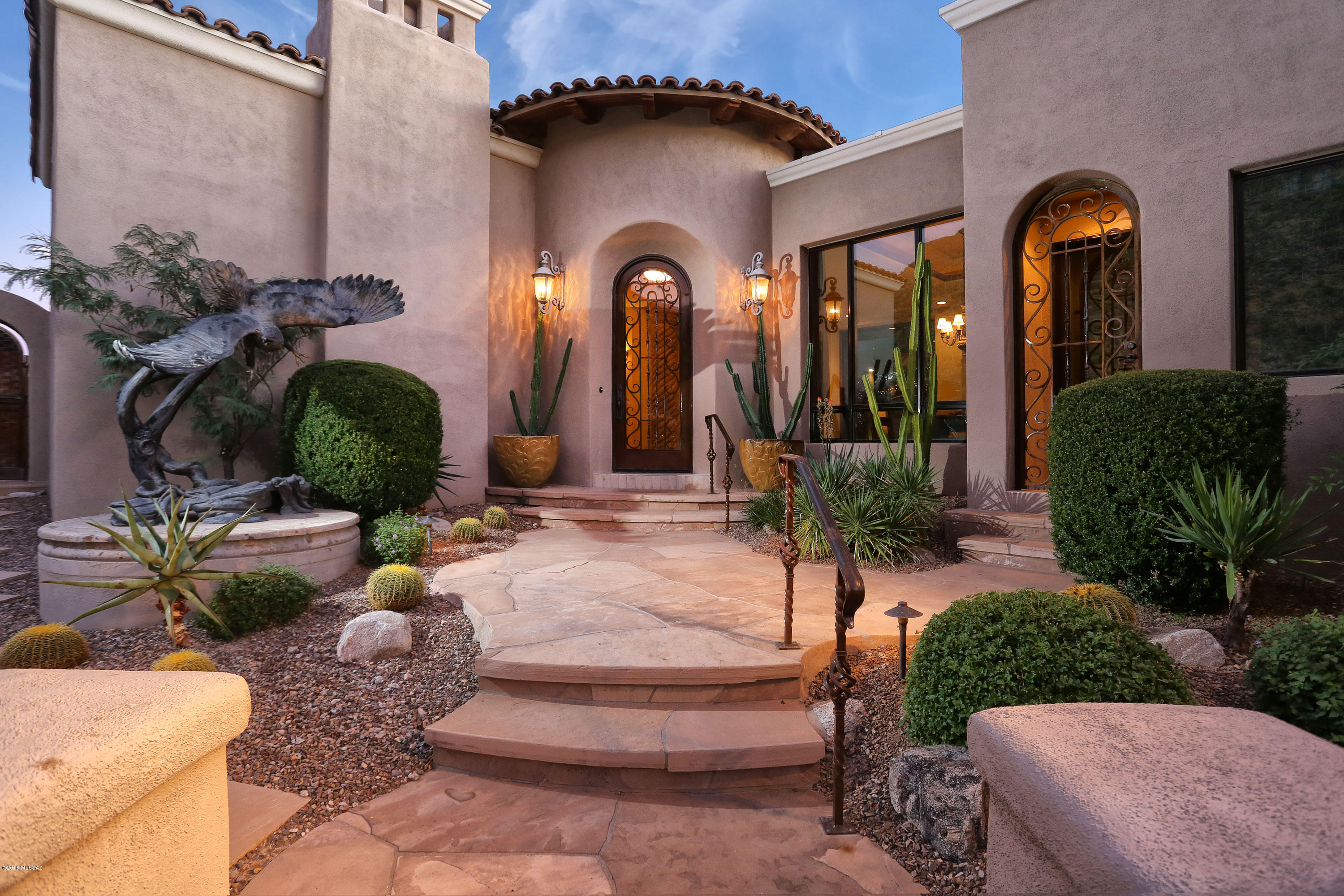 Stunning Mediterranean home sited on 1.81 acres in prestigious guard gated community in The Canyons is now available for the discerning Buyer.  Majestic outdoor eagle statue greets you as you enter architectural bronze front door into foyer with dome ceiling.  Home boasts massive stone FP in LR with unobstructed canyon views, Chef's kitchen w/granite countertops, wood paneled Subzero refrig and drawers, two Asko dishwashers & bar seating for four opens to great room & steps away to resort style backyard with pool/spa, built-in BBQ & beehive FP.  MB suite features 2 master baths, walk-in closets, exercise & sitting area.  Den off MB boasts built in cabinets, hard wood floor & luster stone wall finish.  Spectacular city views from observation deck! 3D tour on MLS photos/virtual tour.