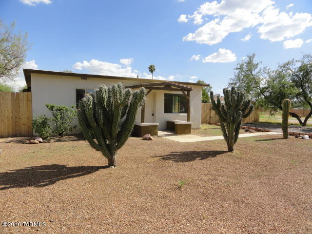Wow!   A wonderfully remodeled, hard to find 5-bedroom gem on a low-traffic street, complete with a huge backyard ready for your imagination.  Completely new kitchen with large pantry,  gas range and dishwasher, updated baths and new windows.  Tile floors in main areas and brand new carpet in bedrooms.  All new interior doors, lighting and baseboards.  How about a wet bar in the dining room with plenty of storage?  Re-textured walls and newly painted interior.  The rear patio is perfect for relaxation or entertaining.  Make the backyard into whatever you need it to be.  Don't hesitate - this one has it all for you!