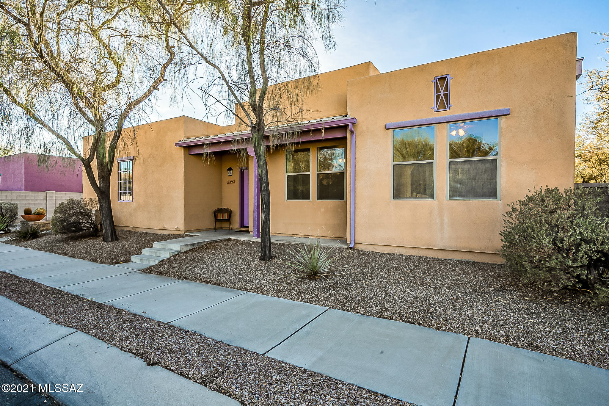 Beautiful southwest home in this gated community, right next to Downtown! this 3 bedroom / 2 bath home is ready to move in, tiled throughout, with a lovely private backyard. The high ceiling will amplify the spaciousness of the large open great room. Minutes to Downtown, Saguaro National Park, the Mercado, Star Pass and The Loop, this is the perfect location!
