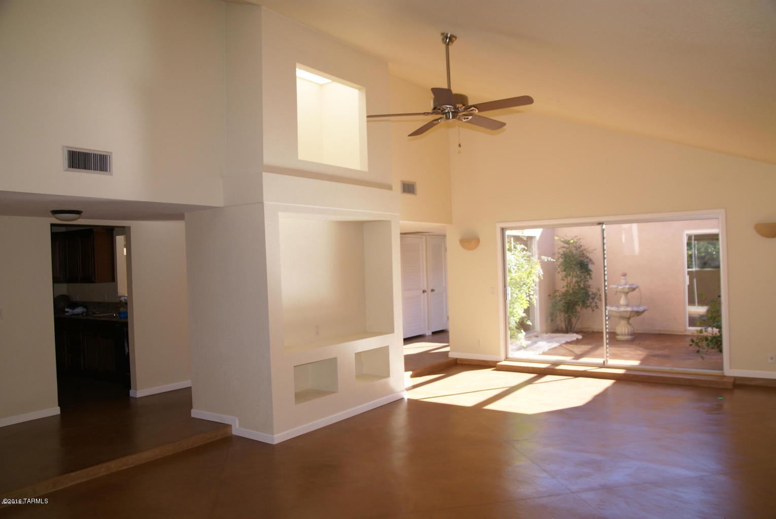 Beautifully updated 3 bedroom 2 bathroom town home in the desirable Catalina Del Rey located near the base of the Catalinas! Spacious open floor plan, vaulted ceilings in great room with fireplace for ornamental use. Three private patios and large windows create abundance of natural light in this wonderful foothills home. Polished colored concrete flooring throughout- no carpeting! Wonderful kitchen with brand new stainless steel appliances and new granite counter tops. Large sized bedrooms, renovated bathrooms. This community features community pools, spa, tennis courts, exercise room, and clubhouse with a library. Rent includes cable, trash & front landscaping.