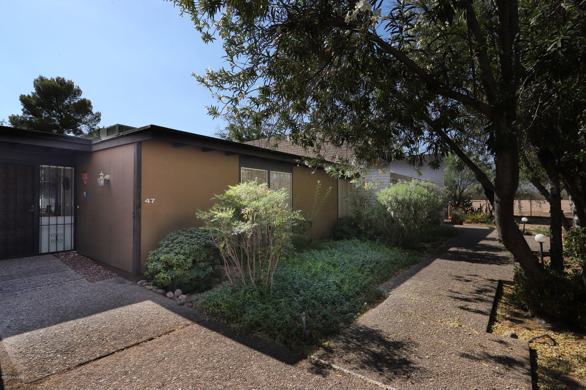 Move in ready, 2 BR/2 Bath + den, townhome in Orchard River Garden Park amidst a pecan orchard. Vaulted ceilings, updated bathrooms, ceiling fans, storage unit off patio. Renowned architect Robert Swaim designed town home that were awarded Landmark Building Award in 1999. Great Central location next to Fort Lowell Park & the Loop bike & Walking Path along the Rillito river. Short distance to shops, groceries, restaurants & Tucson Medical Center. and a community heated pool!