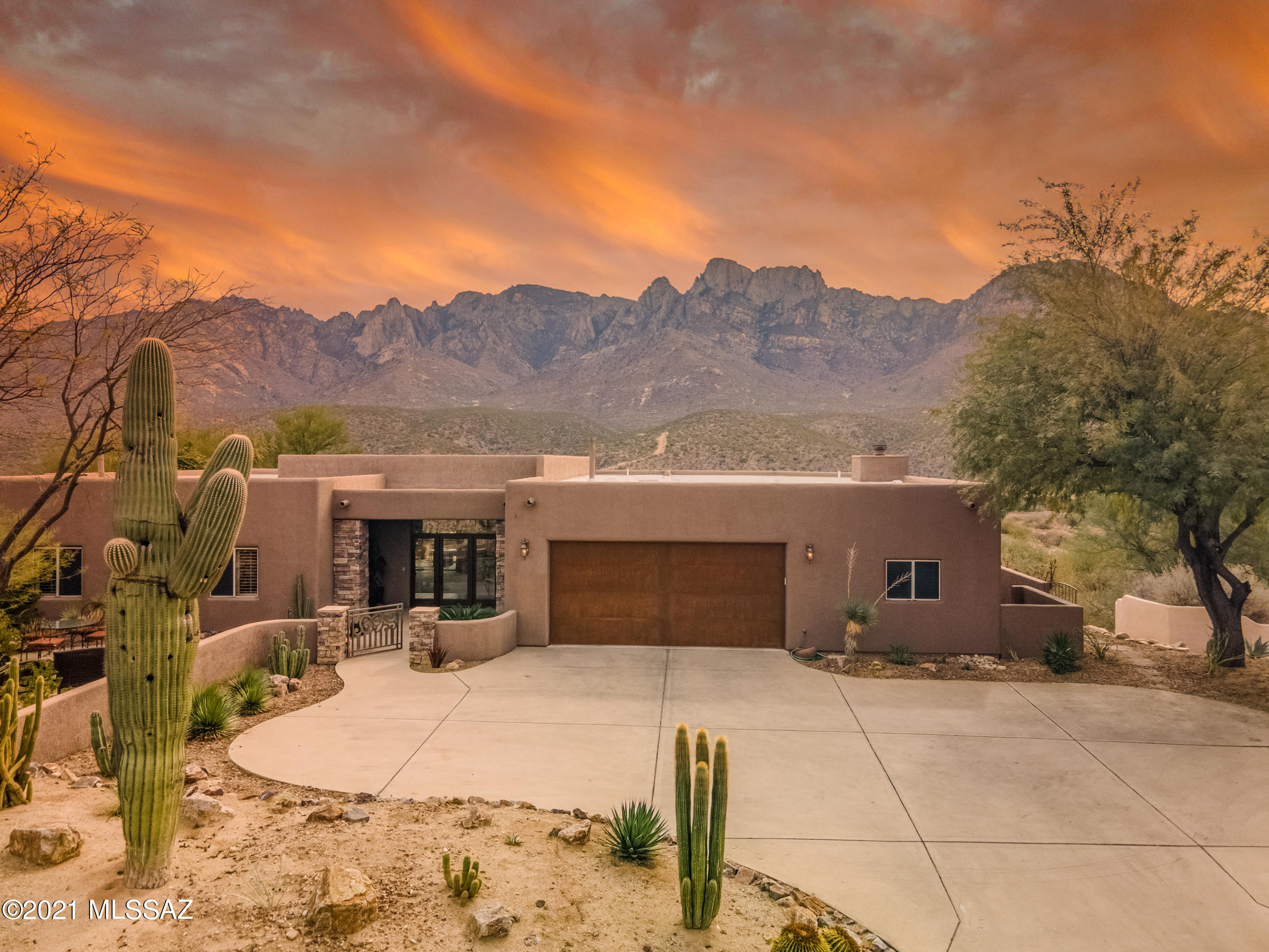 Truly one of the most stunning Mountain Views in Oro Valley - Come and see for yourself as the photos can not capture the majestic nature of the Catalina & Pusch Ridge Mountain View from this home. Sitting perched on this .58. acre lot and feeling private and calming, retreat to your backyard where you may never want to leave.  4 Bedroom 3 Bath home with Travertine Floors, Solid Wood Cabinetry, multiple seating areas, back yard pool, spa, outdoor BBQ and Fireplace outfitted for the perfect outdoor party.  Courtyard seating also a lovely secondary patio space.  Custom built-in Wine Bar holds 96+ bottles. White plantation Shutters throughout.  Your opportunity is here to own a rare and hard to find home on such a magnificent view lot.