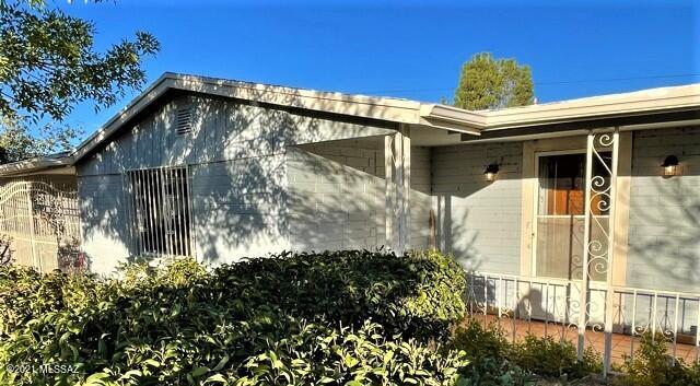This Spacious 3-bedroom 2 bath home with a large back yard is waiting for you to call it your own. Located in a very quiet neighborhood. The 2-car carport has a beautiful double wrought iron gate. New central heat and air conditioning throughout. The entire home has been rewired with a 220-amp service, a cozy finished basement with new carpeting, new Samsung refrigerator, Samsung gas range and new hood. Plenty of food storage in the walk-in pantry, washer dryer hookups in the laundry room, new double pane windows, and a spacious finished Arizona room with a bar that opens to the back yard which would be great for entertaining. The large fenced back yard has plenty of space for gardens, fire pits or whatever it is you enjoy doing outside. There is also a workshop/storage building in the back yard, it could also make a great playhouse. The owner has taken great pride in updating this home.  There are a few more things to do so you can put your own ideas to work.  Make an appointment now to view.