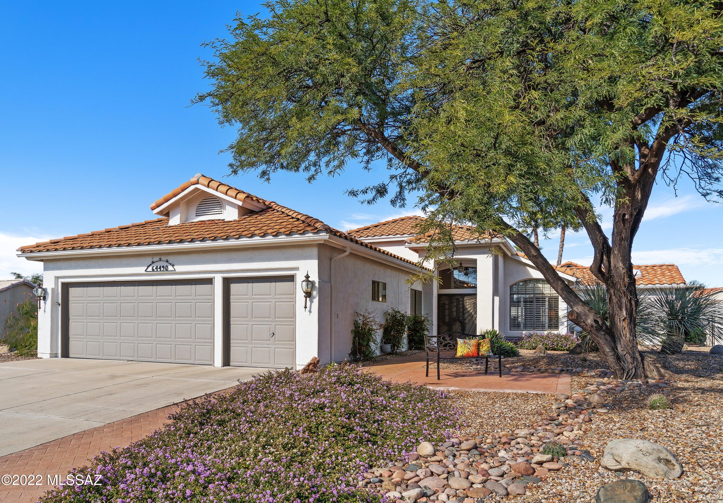 The welcoming front patio where you can enjoy mountain views in the shade of a mesquite tree leads you into this light & airy Ventana model featuring 3 bedrooms & 2 baths. Spacious living & dining room have corner windows & a large skylight. Updated kitchen has lots of beautiful dark wood cabinets & light granite counters, stainless appliances & opens to cozy nook & family room. Large Owner's suite features en-suite with large walk-in tile shower, walk-in closet, & sliding glass door for easy access to patio.   2 guest bedrooms, bath, tile floors except in 1 guest room, 2 ½ car garage with plenty of storage. Beautiful landscaping forms the backdrop for your outdoor living which is enhanced by the Arizona Room & Hot Tub. Come enjoy the best of the SaddleBrooke lifestyle.
