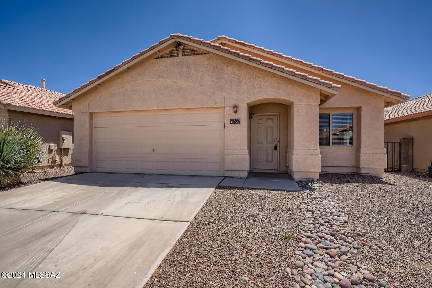 Discover comfort and convenience in this charming 3-bedroom, 2-bathroom home spanning 1,581 sqft., built in 2002, nestled in the sought-after Rita Ranch community. Enjoy proximity to shopping centers and esteemed schools including Desert Willow Elementary, Desert Sky Middle, and Vail District High. Step into the spacious east-facing backyard, perfect for soaking in the morning sun or hosting outdoor gatherings. Ceiling fans throughout ensure year-round comfort, while the double sink and bathtub in the bathroom offer relaxation after a long day. With a garage for your convenience, this home offers the ideal blend of functionality and comfort for modern living.