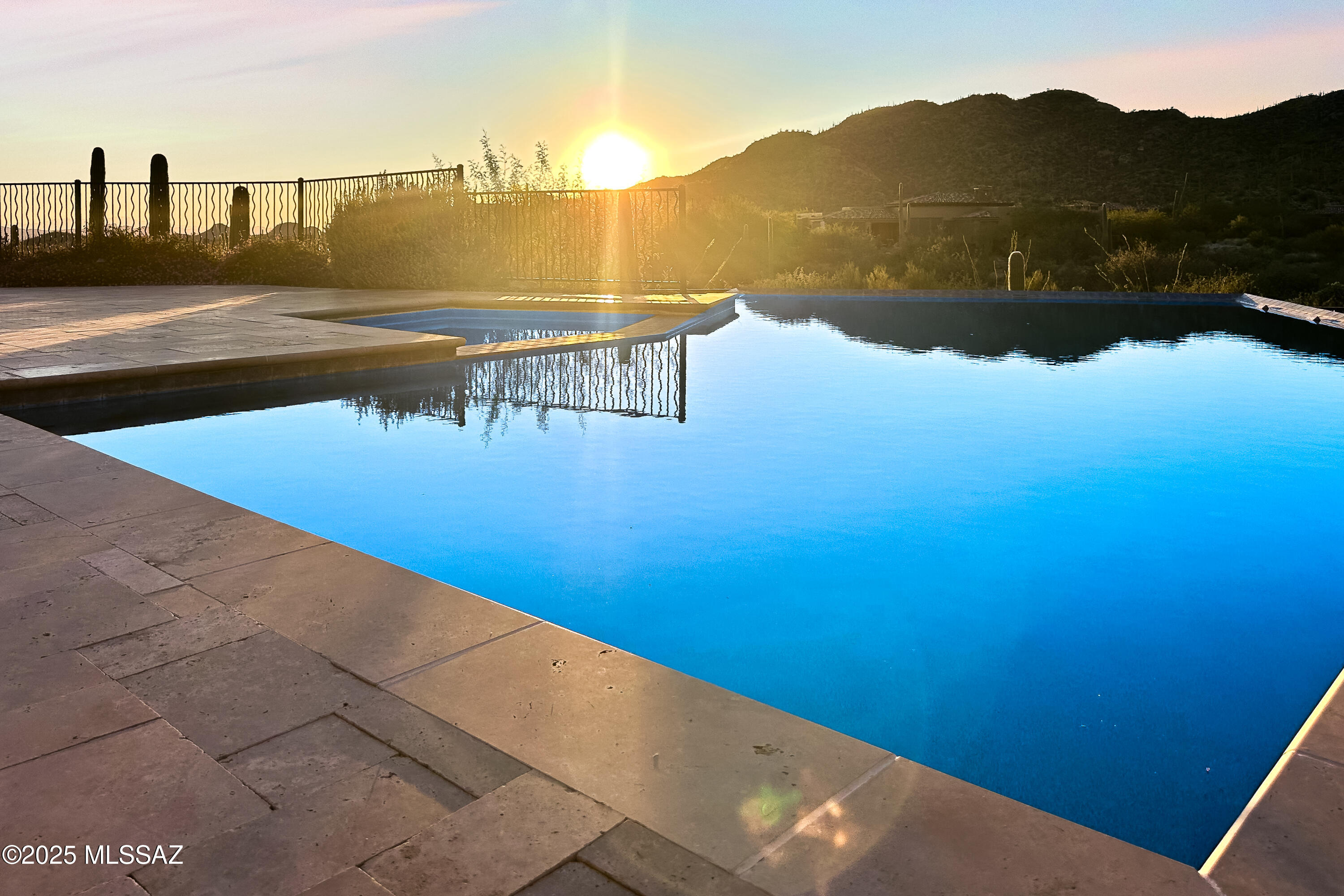 Highly Motivated Seller- Bring us an OFFER!  Seller dropped the price $290K!
Welcome to your dream retreat in the gated community of Stone Canyon, Oro Valley. Built in late 2021, this stunning 3,536 sq ft residence blends modern design, luxurious finishes, and seamless indoor-outdoor living.  
A welcoming courtyard leads into an open, light-filled floor plan accented by elegant tile flooring throughout.  The designer kitchen anchors the home with premium Sub-Zero and Wolf appliances- including a professional 6-burner gas range with integrated grill, oversized refrigerator/ freezer, and stand-up wine cooler- plus a generous center island perfect for entertaining. The adjacent flex room provides for a gym, luxe lounge or office space. 
This home includes two additional guest bedrooms, each with their own en-suite, walk-in shower and generous closet space.  One of the guest bedrooms also has outdoor access to their private patio.  A versatile 4th bedroom, ideal as a large office or studio with private outdoor access.  
Step outside to an expansive patio with travertine pavers, built-in BBQ, fire feature, and resort-style pool and spa- all framed by dramatic Tortolita Mtn views, open desert landscape, and vibrant AZ sunsets.
Residents of Stone Canyon enjoy world-class amenities: a championship golf course, state-of-the-art fitness center and health club with tennis, pickleball, and lap pool, plus a sophisticated clubhouse with restaurant and bar.
Located in highly regarded Oro Valley- known for its safety, natural beauty, and top-tier lifestyle- this is a rare opportunity to own a modern luxury home in one of Southern AZ's most exclusive communities.