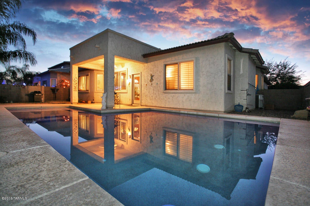 One story home with pool on premium lot backing to common area in popular NW community of Gladden Farms. 3 bedroom plus office. Great room off the kitchen with built-in entertainment center. Plantation shutters throughout. Beautiful 20' tile flooring, upgraded carpet in bedrooms & office. Gourmet kitchen with upgraded cabinets, crown molding & pantry. Dining area with bay window. Breakfast nook & bar in kitchen. Office comes with built-in desk & wall of bookshelves. Large master bedroom with bay window & walk-in closet. Master bath with double sink vanity plus separate shower & garden tub. Covered patio leads to sparkling pool with common area & greenbelt behind. Washer & dryer included. Weekly pool service included. Non-smoking home. 1 year minimum lease. Renters insurance required.