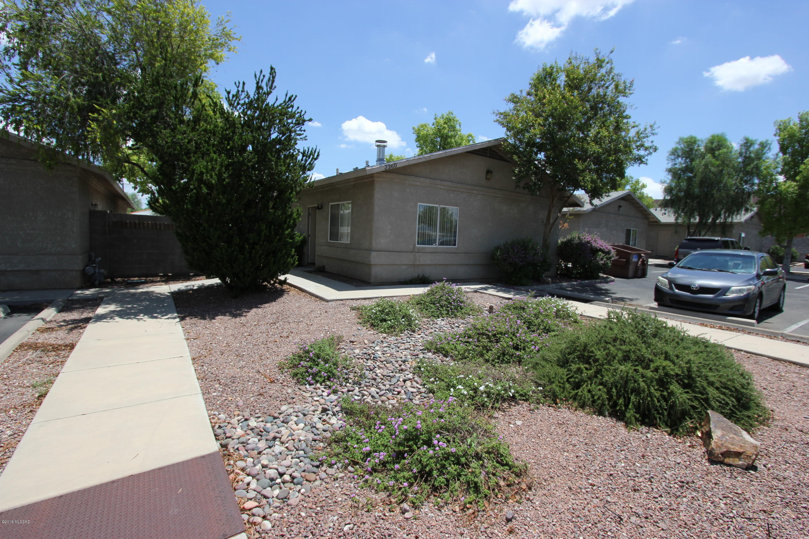 MOVE IN SPECIAL - FIRST MONTH FREE RENT - Adorable 2 bedroom 2 bath townhome with a fireplace in the living room. Accent painted wall for a unique look. Unique stained flooring throughout and no carpet. Kitchen includes ALL appliances. Washer and dryer included in the unit. Plenty of parking. Minutes from the University, shopping , downtown and much more.