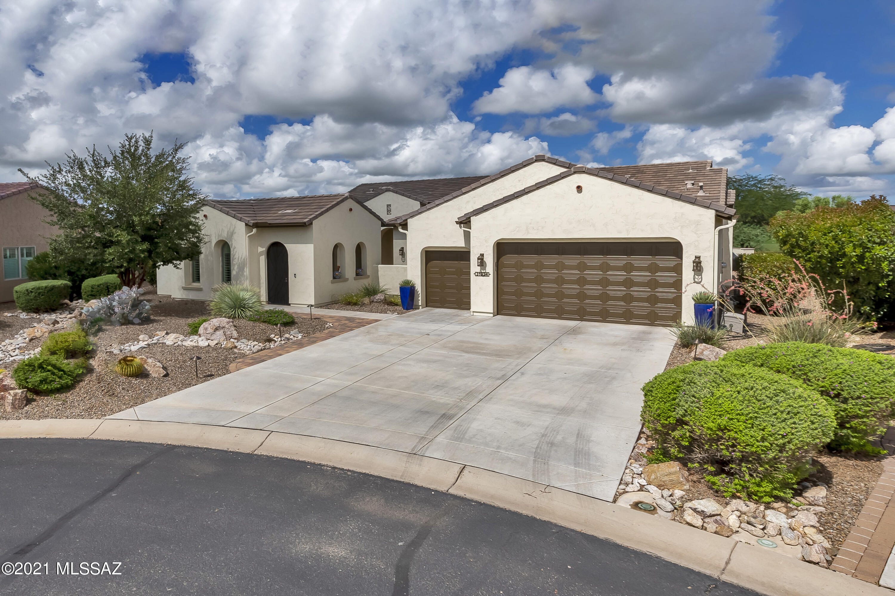 Unbelievable opportunity to own in amenity rich Saddlebrooke Ranch! Better than new construction, this popular model is outfitted with upgrades and beautifully options throughout. Enjoy a beverage  in the beautiful, private courtyard with cozy fireplace. Inside is an expansive great room with gorgeous neutral ceramic tile is the ideal gathering spot for gatherings of family and friends. Chef's kitchen features Caesar Stone quartz counters, upgraded pendant lighting, gas cooktop, walk in pantry, custom backsplash, spacious island, breakfast nook and double doors to courtyard.  Split bedroom floorplan offers quiet retreat for owners suite featuring custom walk-in shower, double vanities and designer storage bench window seat.  Many more amenities and upgrades that you simply must see.