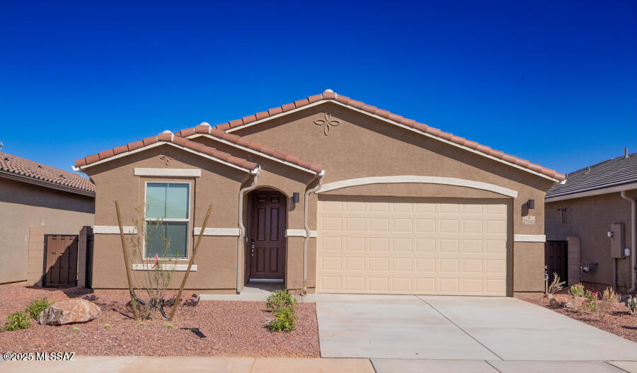 Discover this impressive Juniper home, situated on a generous homesite. Included features: an inviting covered entry; a thoughtfully designed kitchen offering a walk-in pantry, white cabinets and quartz countertops; a spacious great room; a lavish primary suite showcasing a large walk-in closet and a private bath; a convenient laundry; a mudroom and a covered patio. This home also offers ceramic tile flooring in select rooms. Visit today!