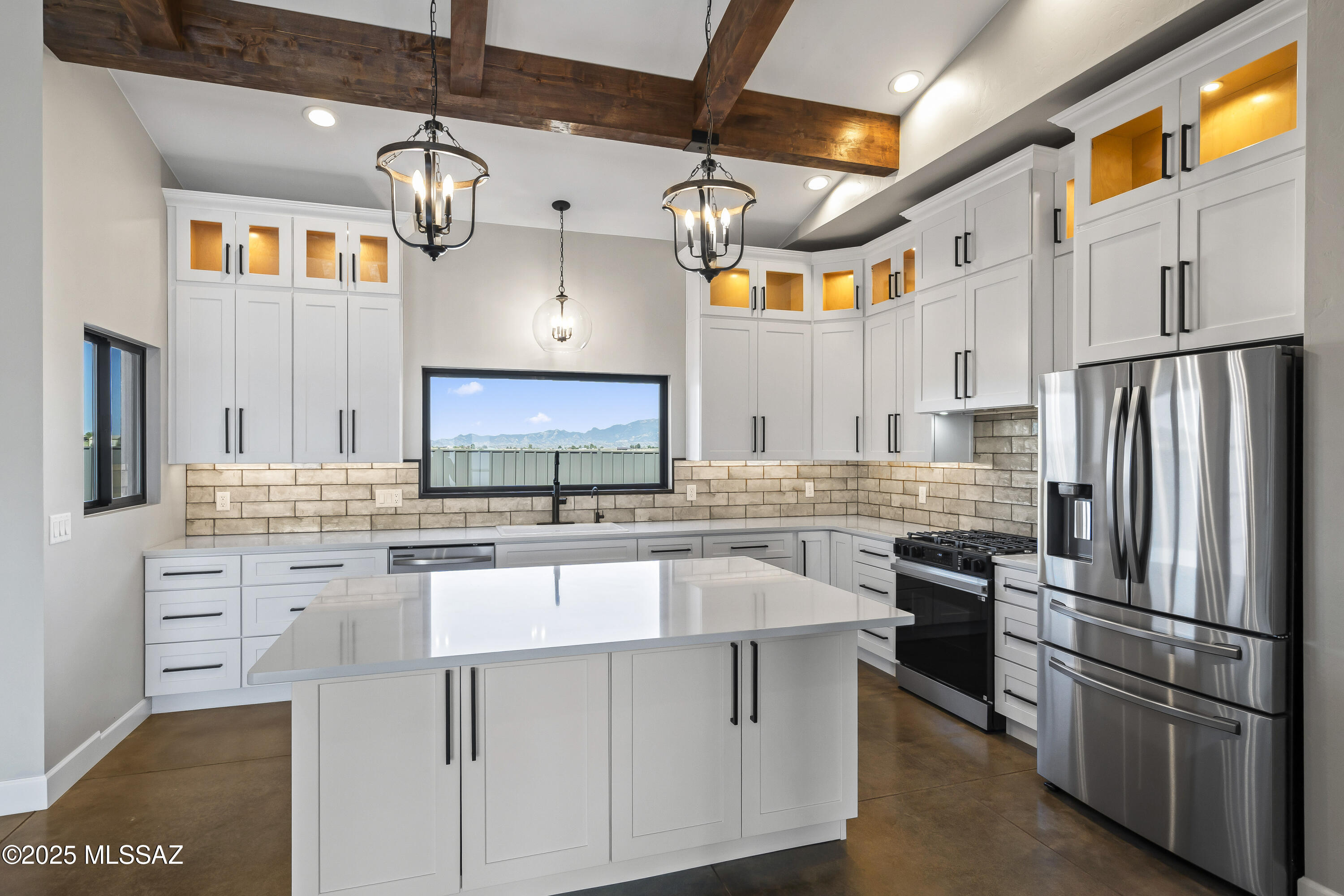 New construction luxury retreat on 4.76 acres! A sweeping circular driveway leads to a jaw-dropping entry, concrete floors, soaring cathedral ceilings with exposed wood beams, and luxe stacked kitchen cabinetry with dimmable lighting and Quartz Della Terra Biancone countertops. Enjoy a full appliance package, exquisite great room, split floor plan, and a spa-worthy soaking tub in the private primary suite. Lounge in the dreamy courtyard off the primary suite, where morning coffee and moonlit moments come to life. Host unforgettable gatherings on the rear patio, framed by epic mountain views and sunsets that feel straight out of a painting.