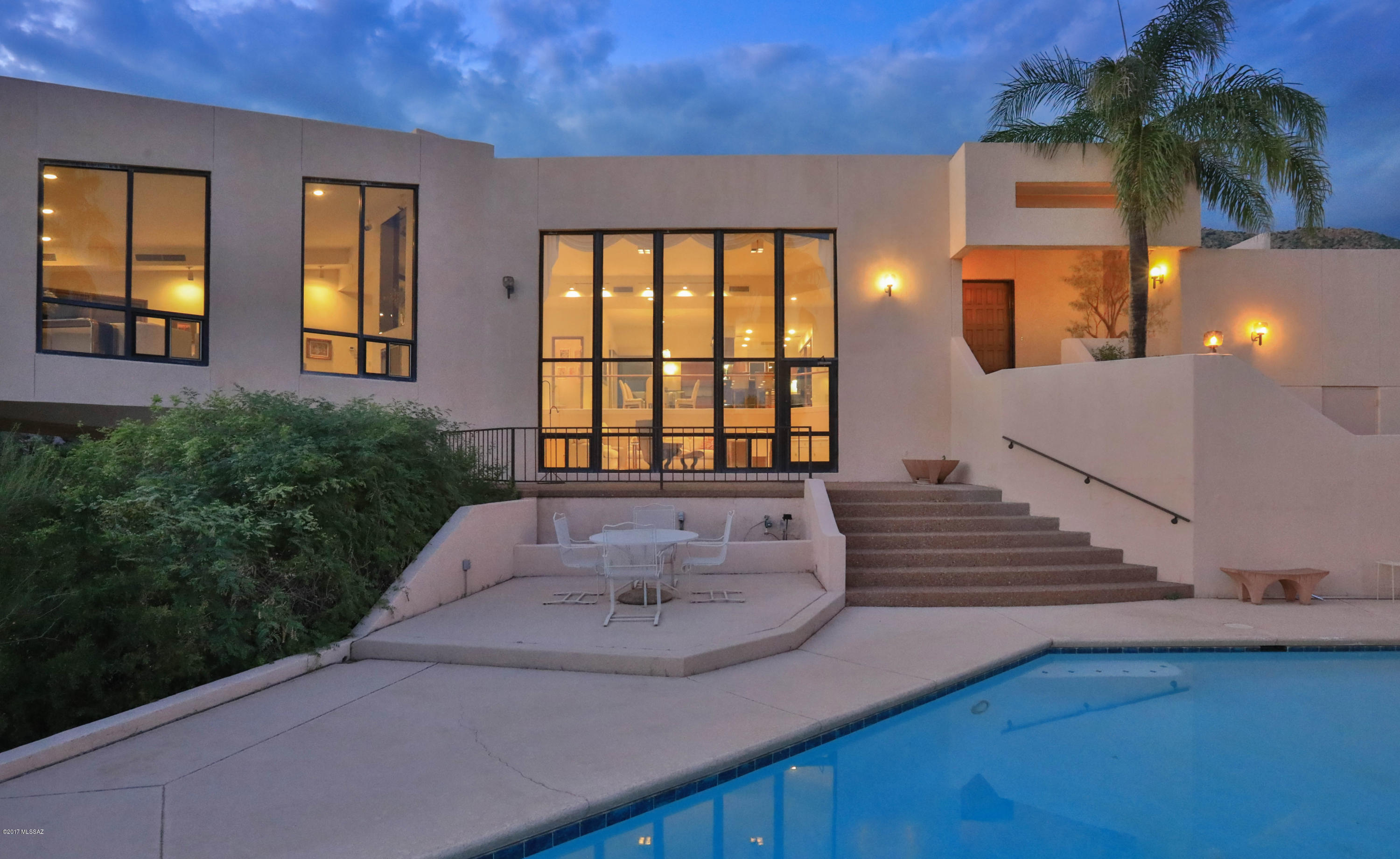 Located on one of the highest lots in Skyline Country Club with unbelievable city, mountain, sunrise and sunset views.  This home is on over 3 acres, sits at the end of a cul-de-sac, and borders the National Forest.  The views and surroundings are truly serene with a small canyon running adjacent the home, and spectacular rock outcroppings and saguaros all around you.  Floor to ceiling windows capture all the natural beauty that surrounds the home and let in an abundance of cheerful natural light.  This home offers a very rare opportunity to purchase such a property for less than the surrounding multi-million dollar properties.  This is a one owner home and was built to commercial standards by an engineer with exacting taste and tolerances.