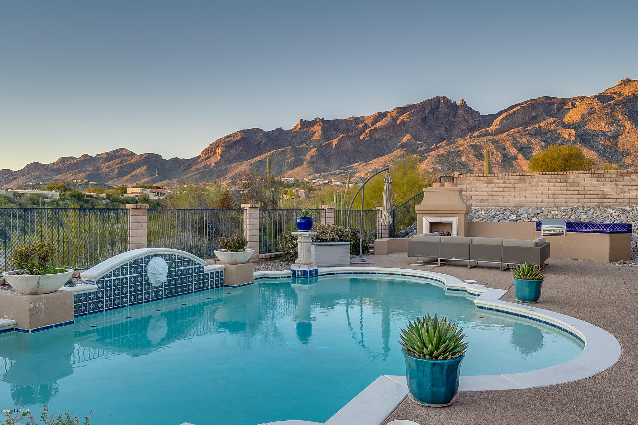 Beautiful contemporary with gorgeous mountain, sunset & city views located in desirable, gated Paloma Canyon. Welcoming front courtyard with double doors opening to a grand entry. Inviting living room w/high ceilings & fireplace, formal dining room, gourmet kitchen w/granite countertops, gas stove top, island, double ovens & generous pantry. Mountain views from master bedroom with wooden floors and spa bath (dual vanities, garden tub and his & hers walk in closets). Large study with built in desks/bookcase. Upstairs are 3 additional bedrooms. Loft area made for relaxing, entertaining or kids area. Covered back patio, pool with fountain, built in BBQ, BB court and turfed play area w/swing set.