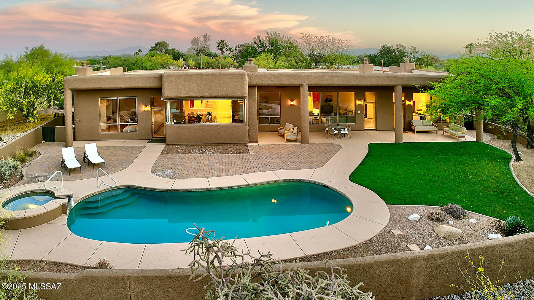 Stunning soft contemporary situated on almost 1 acre in a cul-de-sac with majestic mountain views in the desirable Foothills subdivision of Las Alturas. Lovely front lushly landscaped courtyard, double door foyer entry, exquisite living room & dining room w/ high ceilings throughout, dramatic fireplace, large windows to capture the view, gourmet island kitchen w/ Alder cabinets,  granite countertops, stainless steel appliances, Wolf 6 burner gas stovetop, Bosch double ovens, SubZero refrigerator/freezer, large walk in pantry, built in desk, breakfast area, gorgeous travertine floors, family room w/ fireplace, hard to find 5 bedroom (split plan), 4 baths including primary bedroom w/ fireplace, sitting area, luxurious bath w/ double vanities, tile countertops, Jetted tub.....continued separate shower, large walk in closet and private entry to the rear patio. Laundry room with washer, dryer and brand new roof. Enjoy the resort like backyard with covered brick paver patio, gas heated pool and spa, artificial turf, fireplace, lush landscaping, 3 car garage with large storage room, Dist. 16 schools and sensational mountain views. Picture perfect and move right in!!