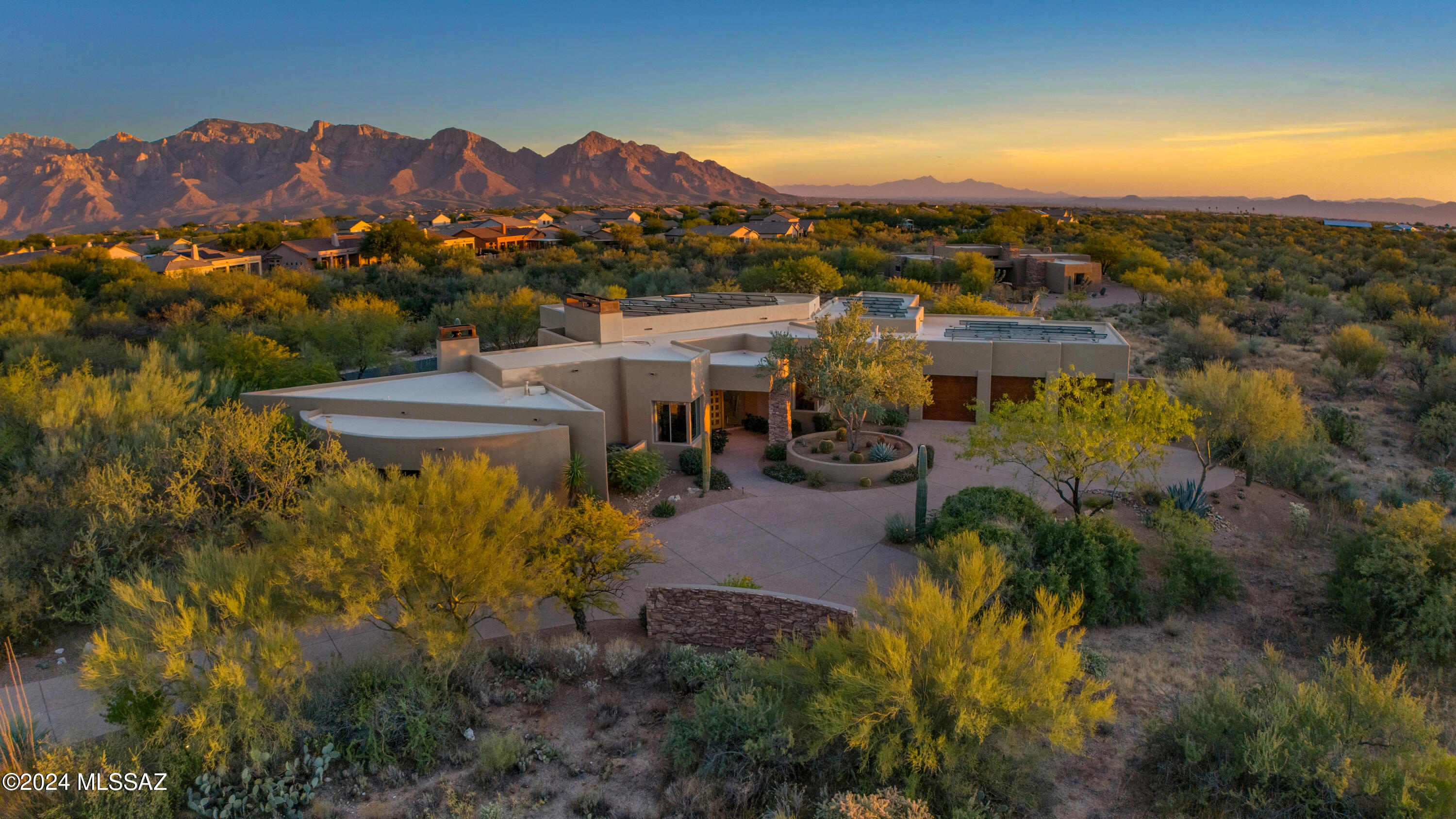 Open House Sat & Sun 2/1 & 2/2 1-3 PM | Timeless Desert Contemporary Home in Stone Canyon. A Golf Community Surrounded by stunning rock outcroppings and majestic saguaros.  This Desert Contemporary masterpiece, designed by architect Michael Christenson, perfectly captures the beauty of the Sonoran Desert, offering a seamless blend of privacy, timeless design, and meticulous care.  

Though modest in size, the home's layout is brilliantly optimized, with soft contemporary lines that harmonize beautifully with the natural desert landscape. Adjacent to a serene common area, it provides an exceptional sense of seclusion while remaining deeply connected to its surroundings.  

Every aspect of the home reflects a commitment to quality and thoughtful updates. The kitchen features newer appliances, complemented by a recently upgraded Trane heating and cooling system, a wine cooler, and a patio grill. An owned solar system further enhances the home's efficiency, reducing the average monthly energy bill to an impressive $87.  

The master suite is a retreat unto itself, with a generously sized bedroom, cozy lounge area with a fireplace, and dual walk-in closets. An additional flexible space off the master bathroom offers endless possibilities, whether as a private office, exercise room, or the ultimate custom closet. The outdoor living area is equally captivating, with a kiva cook station, fire pit, and a hidden steel TV cabinet. A custom mobile iron shade provides relief from the sun, ensuring comfort while entertaining or relaxing.  

Inside, the home offers a range of inviting spaces, including a formal dining room, a charming breakfast nook, and a bar-top seating area that creates opportunities for both family gatherings and quiet moments. A built-in desk and shelving provide a functional yet elegant workspace, while high-end finishes throughout elevate the home's timeless architectural appeal.  

This impeccably designed and maintained home embodies the best of Stone Canyon living. It is more than a residenceit is a sanctuary that celebrates the beauty of the desert and the art of living well.