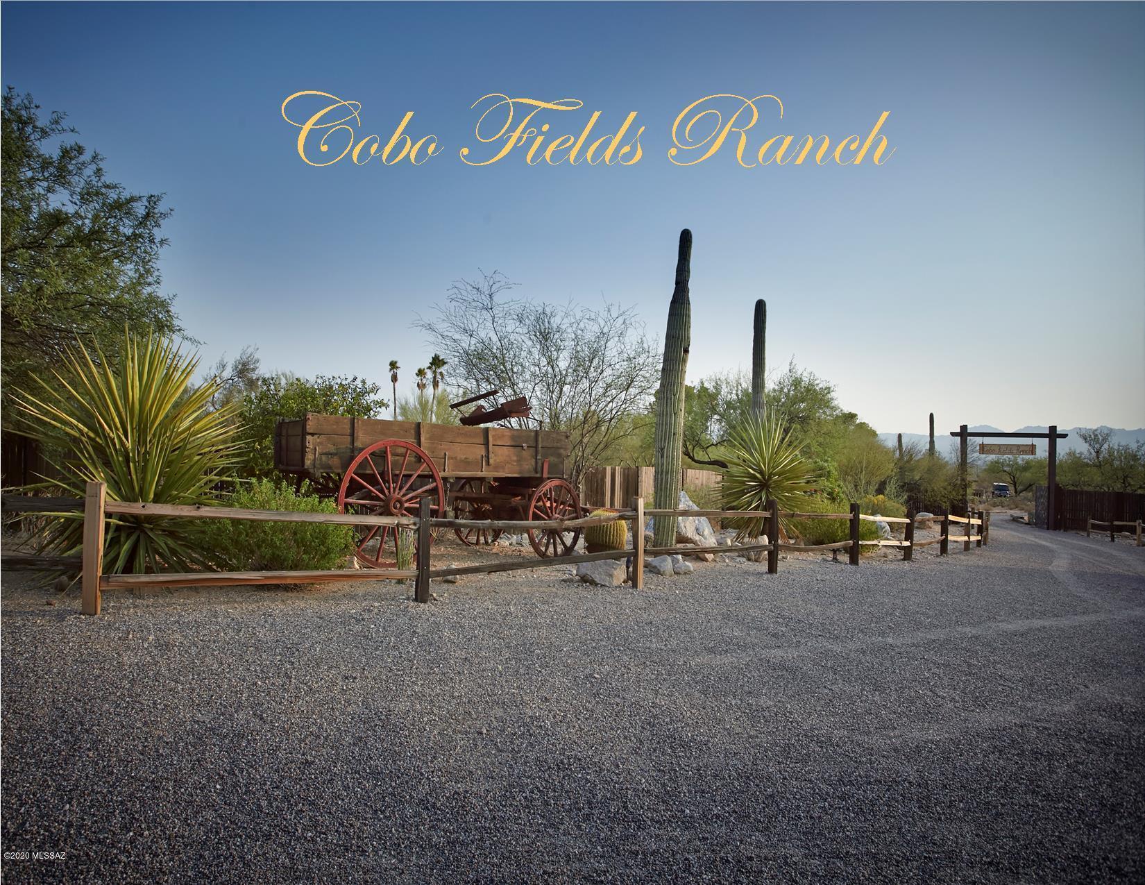 ''Cobo Fields Ranch''- A rare opportunity to own one of the last large Foothills Estates kept intact by the current owners who have preserved and restored this magnificent property rich with history as the only known polo field in the Foothills from a bygone era. This 17.9 acre Gentleman's Ranch offers a unique opportunity to have stables, a tack room, wash rack, a large riding arena, 2 western themed guest houses & a bunkhouse for a true Western Experience for your guest. A private grandfathered well feeds a 2500gal underground storage tank along w/city water for the main residence. NO HOA or CC&R's allow for Air B&B Rentals, boarding horses or parking your fancy show rig & trailer next to your Mercedes for runs to Whole Foods & La Encantada; each only 5 min away. Unlike most Equestrian properties, the main house has been extensively remodeled to reflect a high level of taste and sophistication & can be purchased furnished w/some exceptions. A perfect blend of mid-century modern architecture w/cutting edge contemporary design featuring walls of windows capturing magnificent city & mountain views, a gourmet kitchen w/Viking appliances, 4 spa like bathrooms and two fireplaces. Expansive covered patios w/fountain & built in BBQ, a pebble tec pool overlooking the twinkling city lights & a private gated entry for added privacy. This is a once in a lifetime chance to own a stunning ranch w/endless opportunities nestled at the base of Pima Canyon in the heart of the Catalina Foothills.