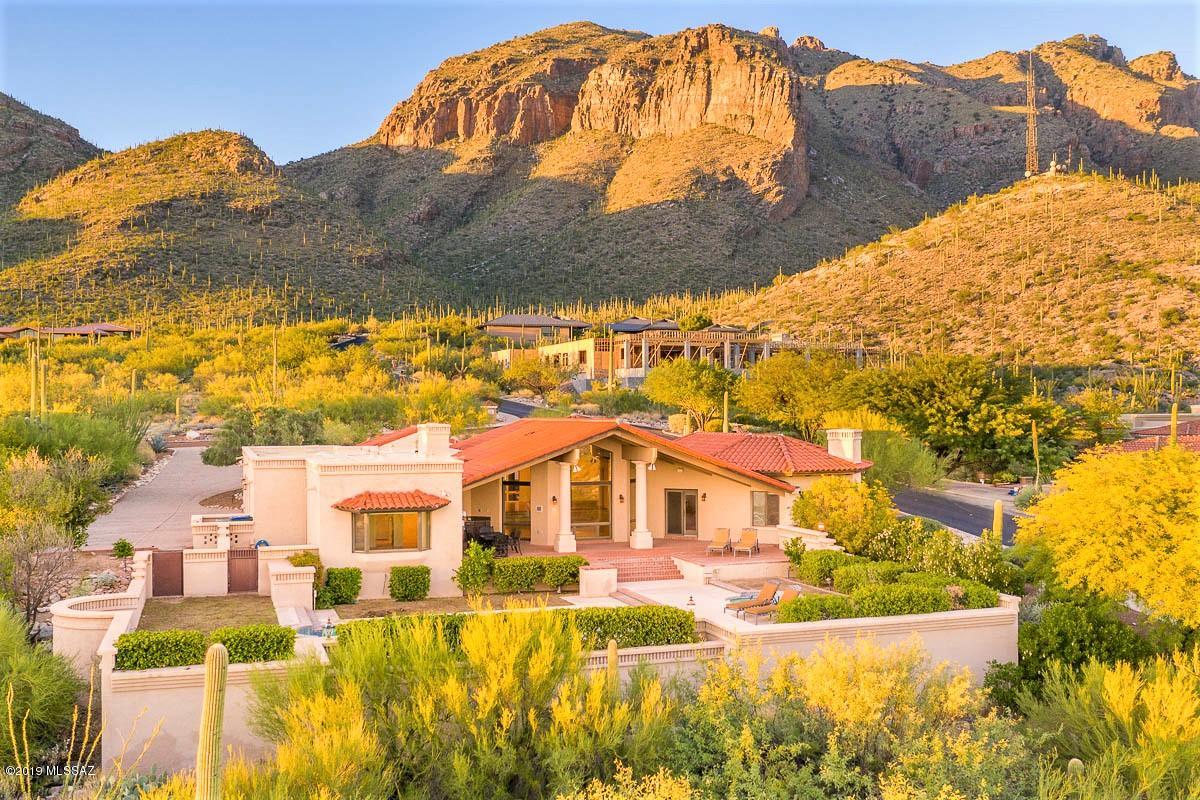 Location, Location, Location! PRIME view property on a majestic Cobblestone premium lot!. Secure and private, guard-gated Cobblestone is Tucson's original Foothills Luxury haven w/  60 Prime View lots and multi-million dollar homes. This David Baird built masonry home skillfully captures the endless, breathtaking views.  Architecturally stunning Great Room w/ vaulted Wood beamed ceilings & 24'' cross cut Torreon Travertine floors. Walls of windows offer unobstructed, Top of Tucson views. Remodeled chef's kitchen w/ large center island, custom Mahogany cabinets , granite counters plus Subzero & Thermador Appliances.  Dual Master Suites w/ Large, remodeled En-Suite bathrooms, walk-in in closets. Gorgeous Outdoor living w/ covered patios, Built-in Kitchen & sparkling Pool & Spa. 3-Car Garage.