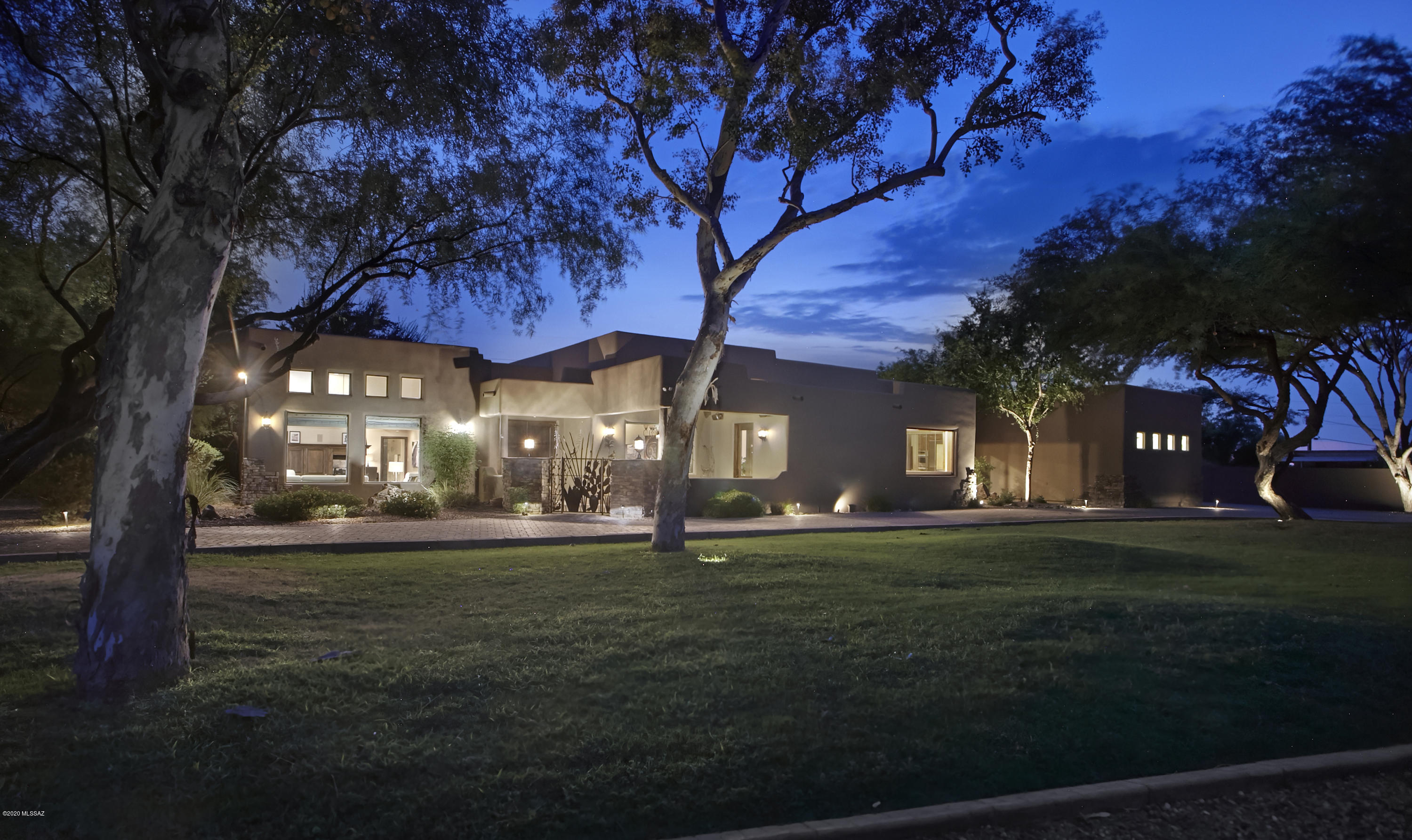 An INCREDIBLE OPPORTUNITY presents itself to own one of the largest parcels in Tucson Country Club Estates ideal for the equestrian buyer or anyone looking to social distance in style! This 5 bedroom/ 6 bath spacious home has been updated to total perfection featuring gourmet kitchen with commercial grade stainless appliances, granite countertops, island with prep sink, double ovens, and an inviting bar perfect for entertaining. Travertine floors throughout, solid alder wood doors and baseboards, walls of windows, and a lavish master suite with fireplace, sitting room, exercise area, custom walk-in closet, and spa like bathroom and a second Master Suite.  The private guest house affords guests a luxurious stay while maintaining the suggested ''6 feet'' distance from main house, but is only steps away from the inviting pool and spa. An incredible resort-like backyard features an outdoor kitchen/bbq area, sports court, fire pit, lush lawn, mature mesquite trees, and expansive covered patio with outdoor tv, and rare for TCC, a spacious 4 car garage with storage. The included 5-acre parcel would be ideal for a horse lover, a kid's dream playground, or a big kid's pole barn for toy storage. Properties like this rarely come on the market in TCC and should not be missed!