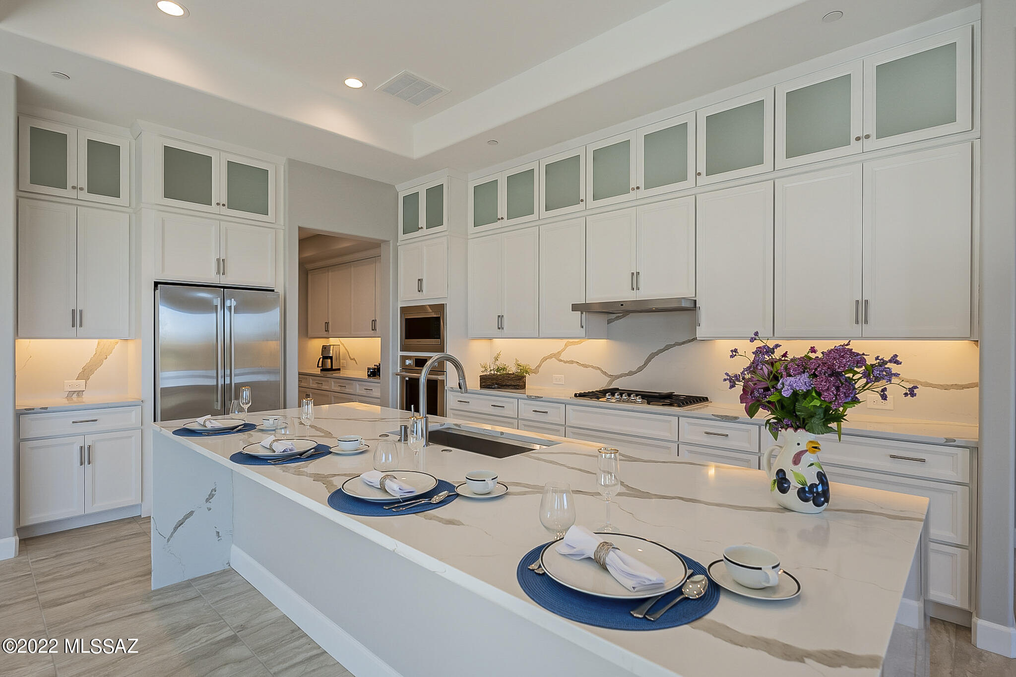 NEWLY BUILT NOV 2022! Never occupied.  Stunning, 3BR, 3.5BA, Avalon with mountain views and $288k of options. Don't wait months to build and don't spend 25% more!  Move in now and experience country club resort living in Quail Creek.  Extended outdoor back living spaces with stackable, moving glass wall systems from the master and great room brings in light.  Kitchen has contemporary 41'  soft close cabinets, dovetail drawers and pull-outs, crown moulding, coffer ceilings, quartz countertops w/waterfall wrap, under-cabinet lighting and GE Monogram appls. Comfort height toilets in all bathrooms. 12''x24'' floor tile. Carpet in the two guest bedrooms. Solid core doors. Added insulation in the 4 foot extended, epoxied, 3 car garage. Too much more to mention! Come visit soon to see it all!