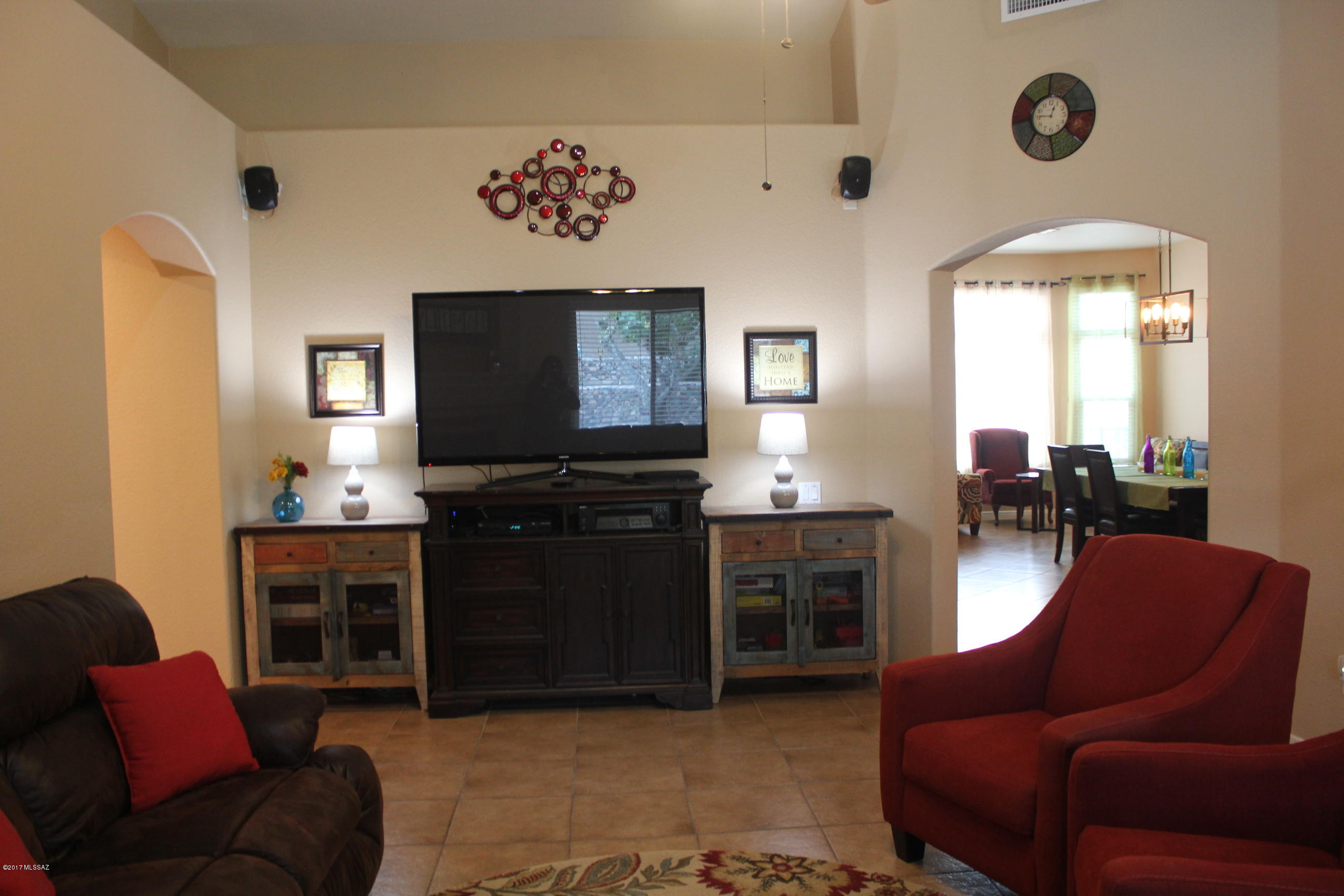 Model like condition tucked on a private cul-de-sac. This 4bed/2 full bath popular great Rm.plan offers both formal and casual areas. New Low E-High Energy eff. windows just installed. Lrg.kitchen hosting eating nook, lots of cabinets, separate panty & spacious center island joining great room. Cozy up to the corner fireplace while gazing out the large windows overlooking rear yard adorned w/fruit trees, rose bushes & a sparkling pool, perfect for enjoying AZ outdoor living. Master features bay window, master bath retreat w/extra lrg. master shower, designer tile/glass enclosure, garden tub, executive height vanity w/dual sinks & walk-in closet.  Custom hardware, light fixtures & hardware. Designer appeal throughout! Move-in ready don't miss this opportunity.