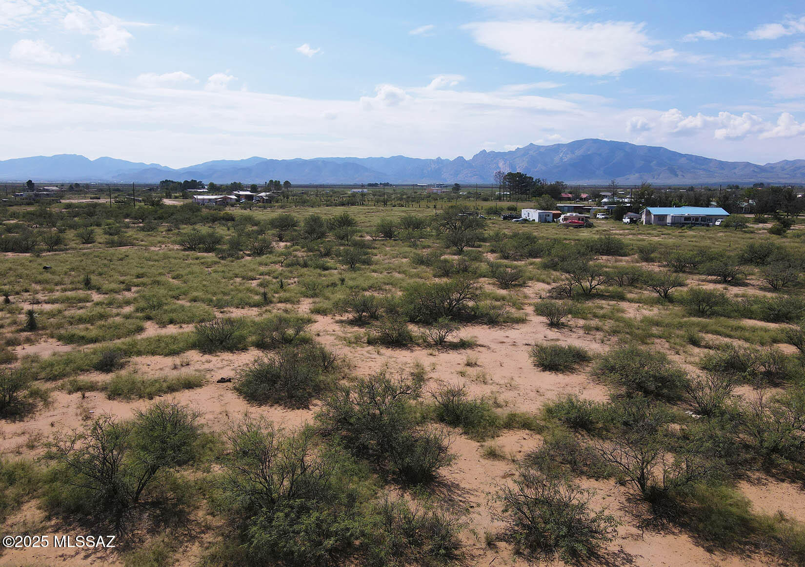 Five acre RU-4 zoned parcel in Richland Ranchettes with quick & easy access to Highway 191. Power, phone & fiber at the lot and site has flat topography, making it easy to build & develop. Drill well or haul water. Zoning provides great flexibility for structures and dwellings; manufactured, mobile, site built and.or Cochise County builder opt-out are OK. Beautiful panoramic mountain views in every direction. Close to town and the highway, making shopping and errands much easier than being buried way back on a dirt road. Central location makes quick trips to Benson, Willcox or Bisbee a breeze. This parcel is at 4500 feet in elevation making for mild summers and a great growing season. Many possibilities here for your country dwelling.