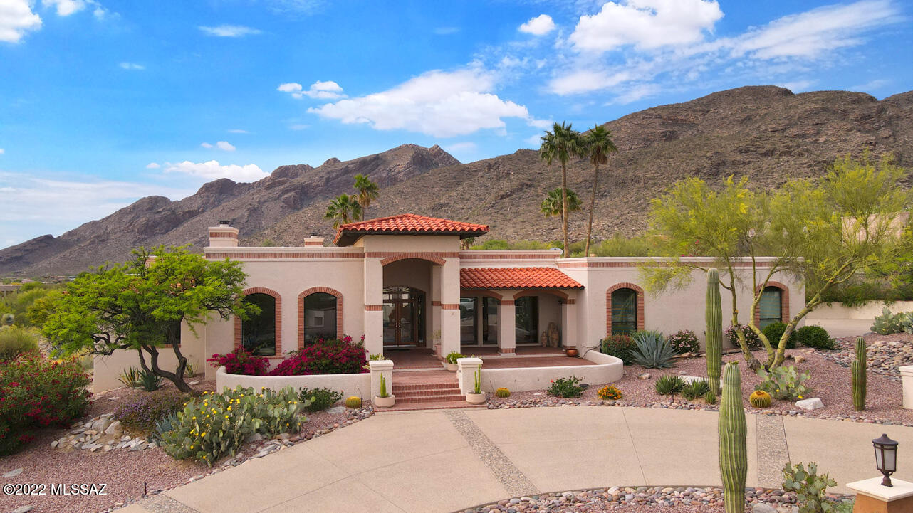 Very private home located in  desirable Cobblestone, one of the most sought after communities at the Top of Tucson. Timeless remodeled home with soaring beamed ceilings, remodeled kitchen, quartz countertops & all new Cafe' appliances , that opens up to a family room perfect for entertaining. Large separate living and dining room, A VIEW FROM EVERY ROOM. Beautifully landscaped rear-yard for year-round living in a resort-style backyard.  Swim in the beautiful pool, while looking at the majestic Catalina mtns and city lights. Multiple sitting areas to enjoy sunsets, sunrises, mountains and city views. Spectacular a/c & heat pump garage,18R insulated door with beautiful cabinets, work area, and bathroom.  EASY INTERIOR STEPS -2 steps in 5 areas. Interior doors, woodwork recently painted white Cafe' 48 inch dual fual stove recently installed