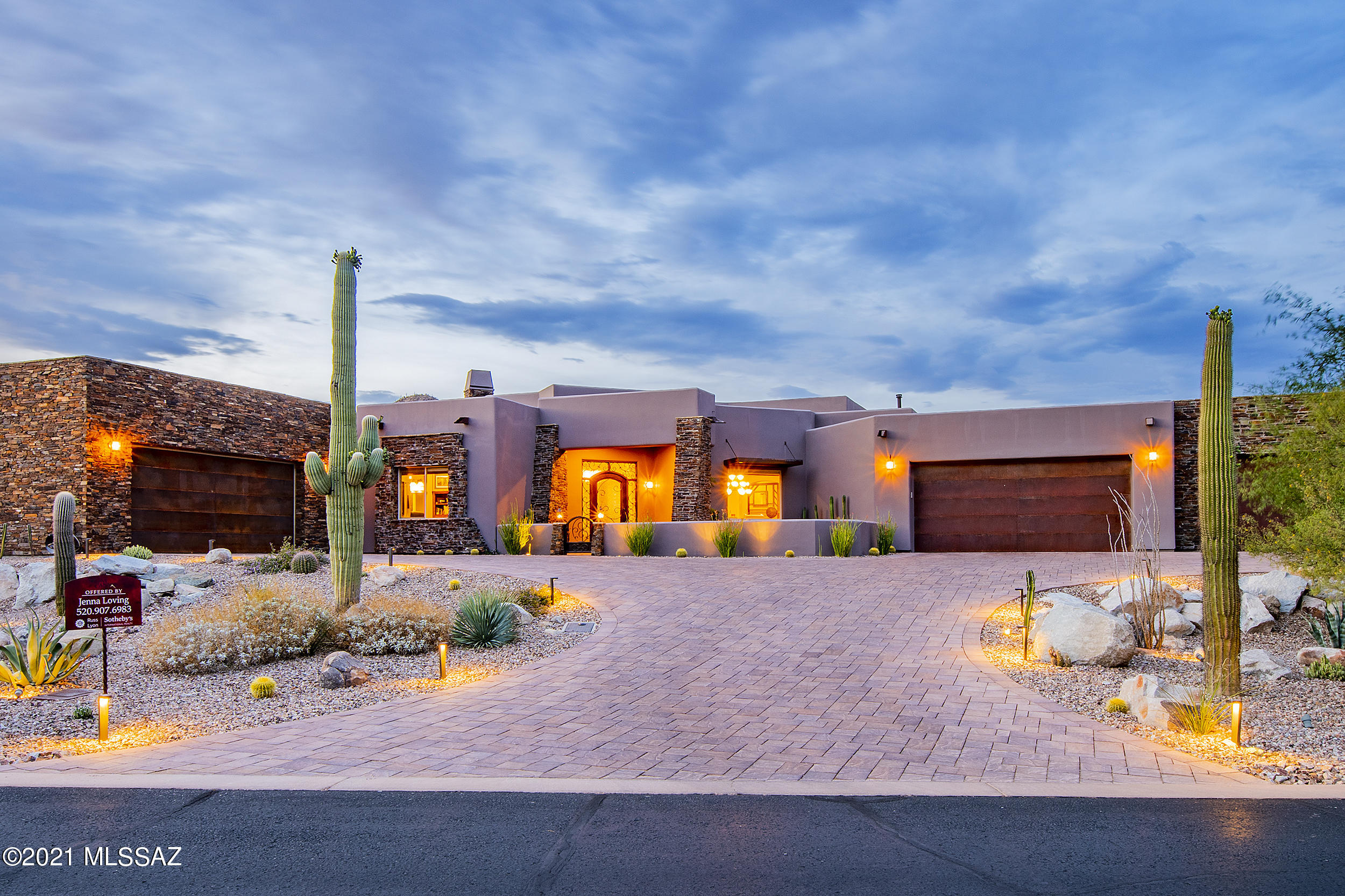 Stunning Stone Canyon Estate with amazing mountain views from every direction set within the exceptional Phil Mickelson Golf Community! If you are looking for a mini-resort, you have found it here! 3,479 s/f, 4 bedrooms (all ensuites with walk in closets), large great room with fireplace provides an open concept between main areas which is perfect for entertaining. Formal dining area has a wet bar, plenty of cabinetry, glass rack, wine fridge and beverage fridge. Two islands in the large kitchen, prep sink, breakfast area, high end appliances, pot filler, copper vent hood and plenty of cabinet and counter space. Unique tile applications throughout the home including two glass ceiling inlays - one in the kitchen and one in the dining room. You won't want to leave the backyard!! Large covered patio situated perfectly to provide all day shade, travertine stone, elevated infinity edge pool that provides wonderful waterfall sounds, spa and fire bowl water feature. There is an outdoor BBQ, four hole putting green with elevated pitching area and separate pet area. The Ramada is a perfect place to hang out and was designed with fireplace, TV, dimmable lighting and chandelier. The banco seating is one of a kind with a backrest design that provides a cutout along the tops to ice down your drinks, place your beverage or even plant some flowers as it is complete with drainage and irrigation. Large paver driveway provides great access for you and your guests. There are 5 car garage spaces - three spaces attached to the main house plus an impressive additional two car garage with mini split cooling system and Moduline cabinetry with sink.  Stone Canyon is a unique community in Oro Valley, AZ amongst large boulder outcroppings and provides 24/7 guard gate access, world class golf, athletic center, lap pool, tennis courts and an exceptional clubhouse/restaurant/bar with boulder views of the 18th green.