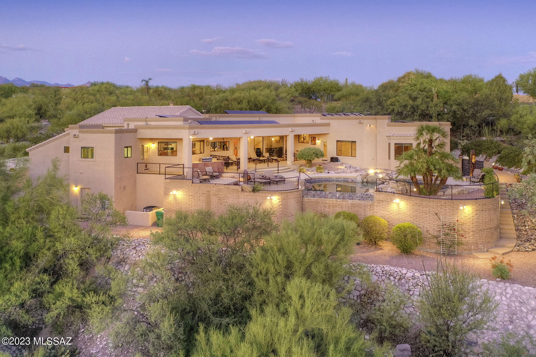 Stunning soft contemporary w/majestic city & mountain views on a very private 3/4 acre homesite in the Foothills neighborhood of Sunrise Territory Village. 4321 sq. ft., Exquisite living room w/dramatic high ceilings, formal dining room w/ built-in cabinets, light & open gourmet island kitchen w/top of the line stainless steel appliances, tile countertops, breakfast bar, open to family room w/fireplace, floor to ceiling windows to capture the views, very desirable 4 bedrooms + executive study w/built-ins & 4 baths including primary suite w/sitting area, 2 large walk-in closets & lux. bath, laundry rm & fabulous 2009 sq. ft. 3 car garage including rm for a small RV. Resort like bkyd w/covered patio, pool, spa, BBQ, long brick paver driveway, Dist. 16 schools & views views views!!!!