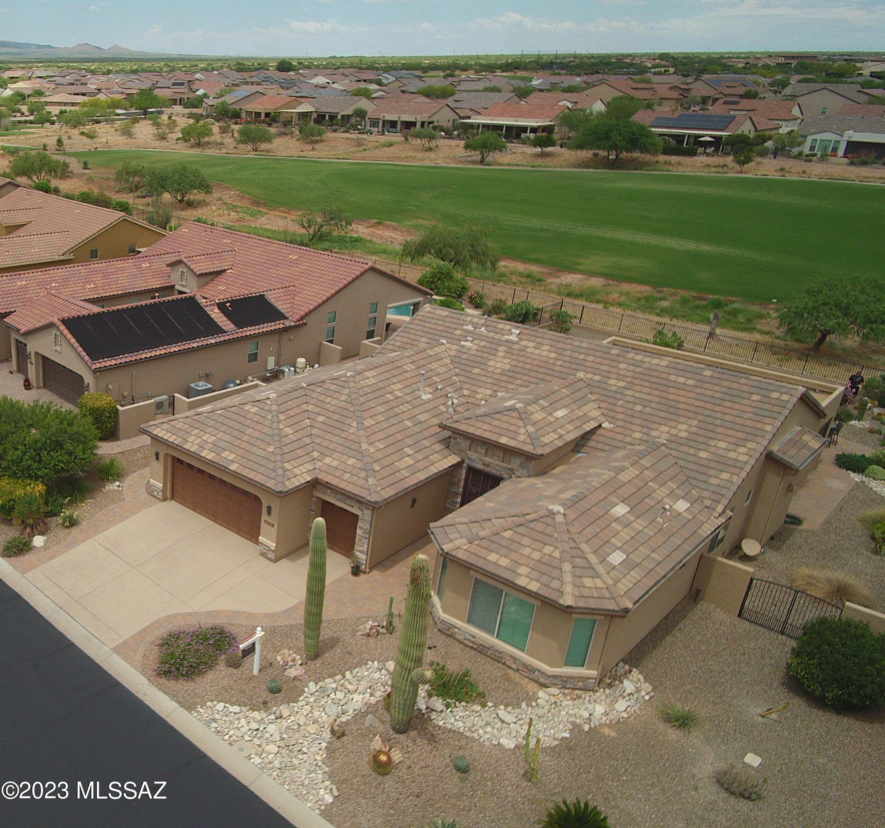 This amazing home offers both golf course and mountain views with an extended patio perfect for nightly entertaining. The interior features wall to wall tile in the living area, a modern fireplace in the great room, a formal dinning area, a Den and a guest bedroom with an ensuite bathroom. Plantation shutters throughout keep this home cool on those warm summer days. Complete with furniture and all the amenities allowing you a ''Turn Key'' home. This Home Is nestled inside the gated community of Saddlebrook Ranch within proximity to the Ranch House Clubhouse, offering casual & fine dining, resort-style pool, golf course, fitness & sport facilities, dog park and more!     Enjoy the social gathering spaces inside this beautiful Robson Community while meeting new friendly neighbors!