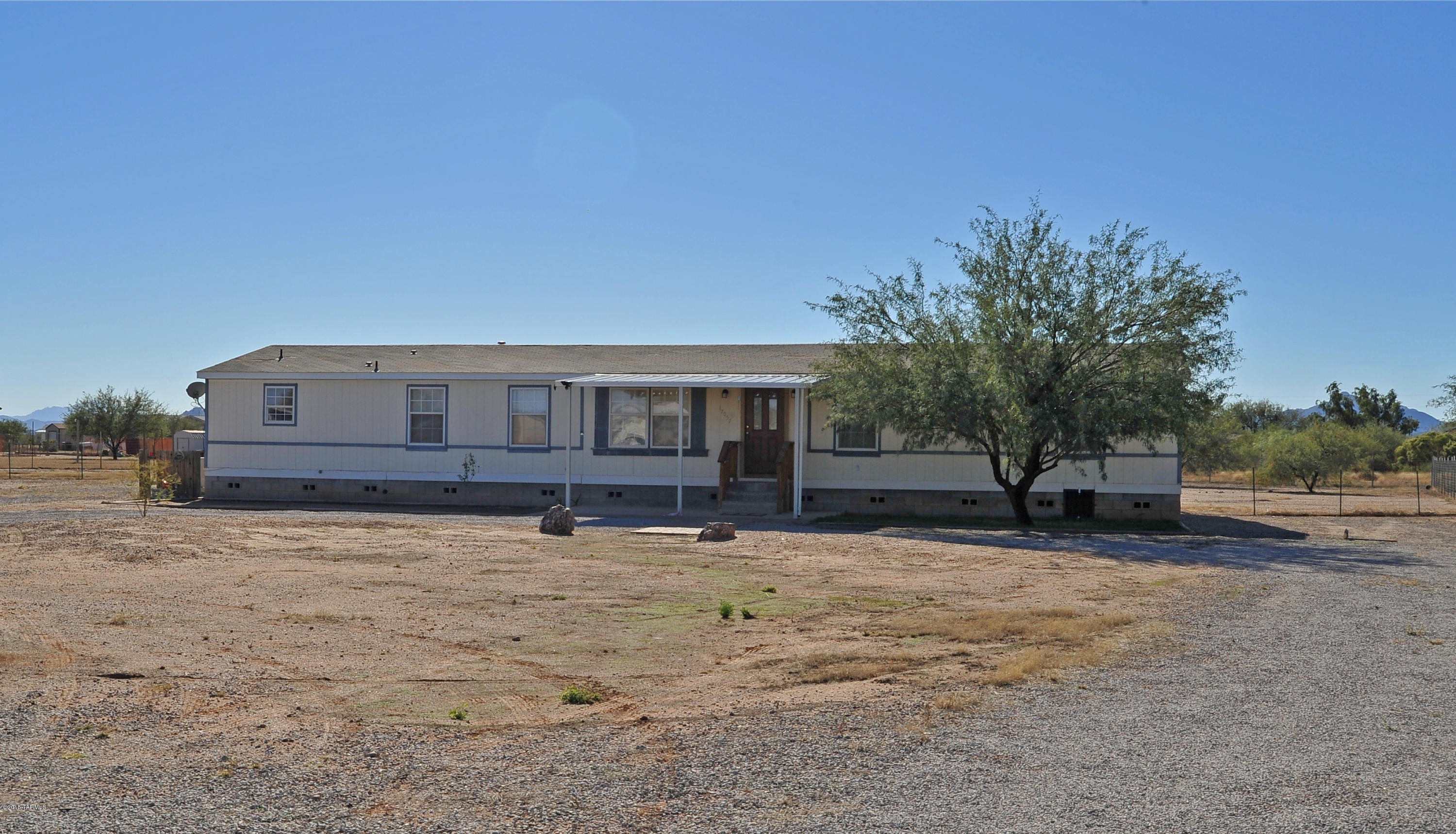 What a great opportunity to enjoy country living!  Spacious home with 5BR/3BA so there's plenty of room for everyone!  The Master BR features a wonderful bathsuite and there's another BR with its own bath ~ perfect for a guest or next gen living. Covered porch the full length of the home offering great views.  Located on over an acres, so bring your 4H projects and kids to check this one out.
