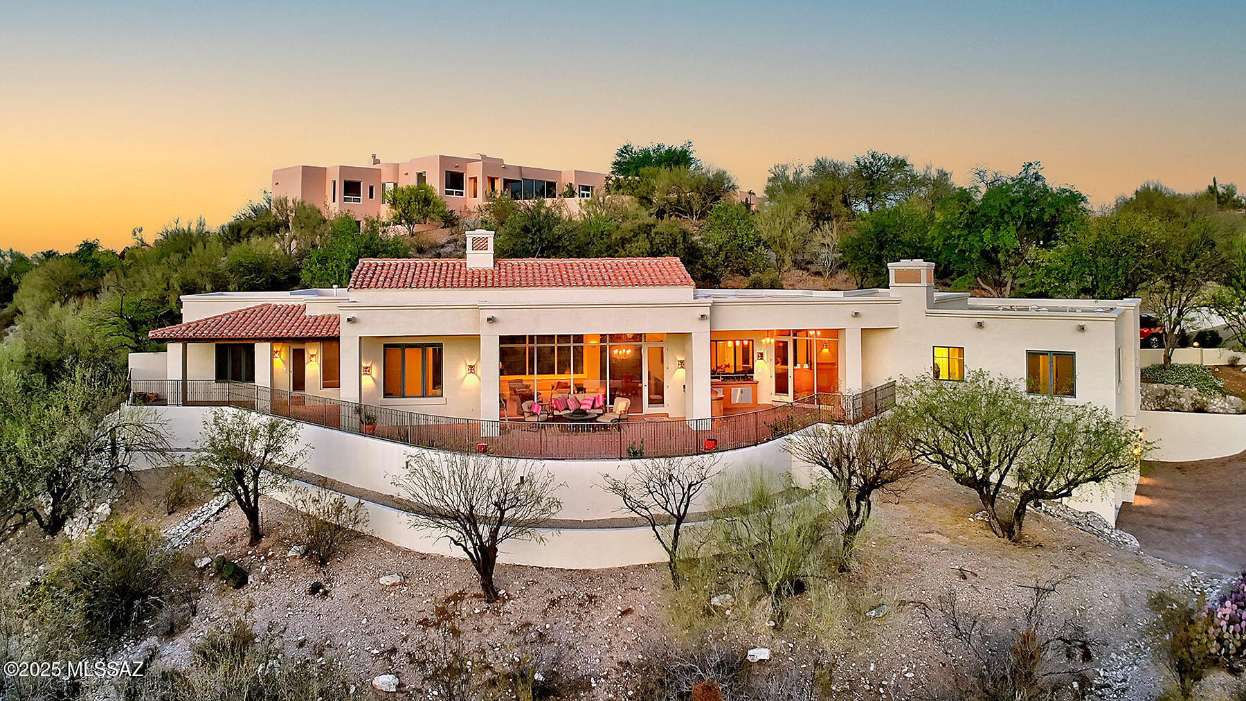 La Quinta styled, Mike Franks designed home, built by Jeff Franks with great mountain views. Inviting courtyard entry with fountains, entry door opens to the great room with sensational mountain views. 4 bedroom split floor plan in main house with attached casita. Main living area all on one level/garage below. Expansive kitchen with separate eating area and adjacent family room. Timeless quality finishes including Pella windows, custom milled window walls, Saltillo, wood and carpeted flooring, all in original perfectly maintained condition. Covered outdoor patios with brick-on- sand floors plus full outdoor kitchen.