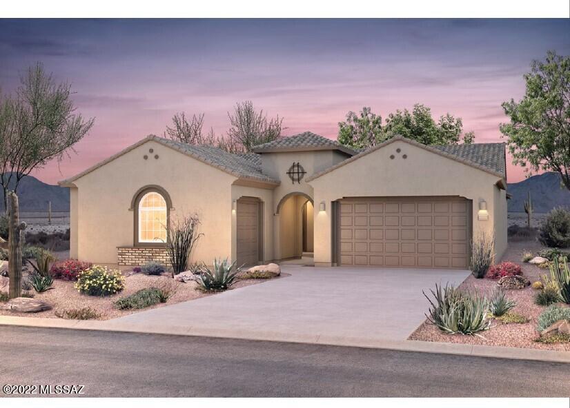 This beautiful Patagonia home design features a frame walk-in shower in owner's suite, guest suite, chef kitchen layout with upgraded granite countertop, gray maple cabinets and flooring throughout home.  The home's backyard faces common area.