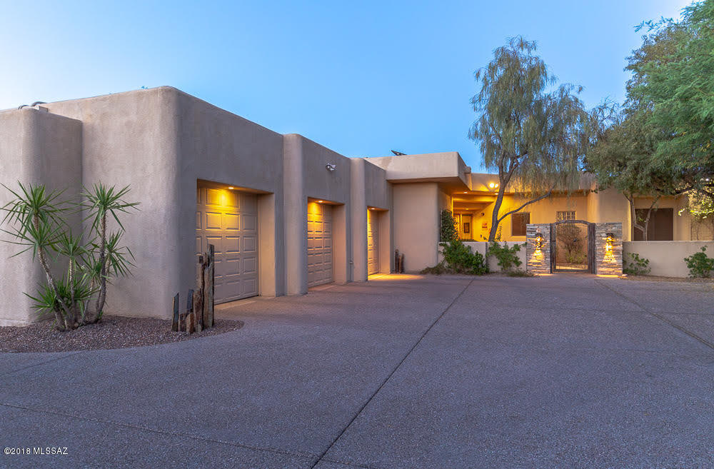 OPEN HOUSE SAT 7/21 & SUN 7/22  2-5P.Elegant 3877sqft, 4BR/4BA SW Contemporary home situated on private 1.1A built by premiere builder Doug Mills in prestigious gated Hacienda Del Sol Estates. Wonderful courtyard entry, fabulous high tray ceilings, travertine tile throughout (no carpet), 3 masonry FPs, large rooms w/custom designer touches throughout. You'll love cooking & entertaining in this  gourmet island kitchen W/professional grade SS appliances, slab granite countertops, desk space, enormous pantry. Dist 16 schools. Resort style outdoor living features 4 manicured landscaped separate yds, completely enclosed dog run, outdoor kitchen area & a large salt water pool & spa. Solar panel PREPAID leased system no mtc costs - 16 yrs left on lease. Average $350/year electric bill