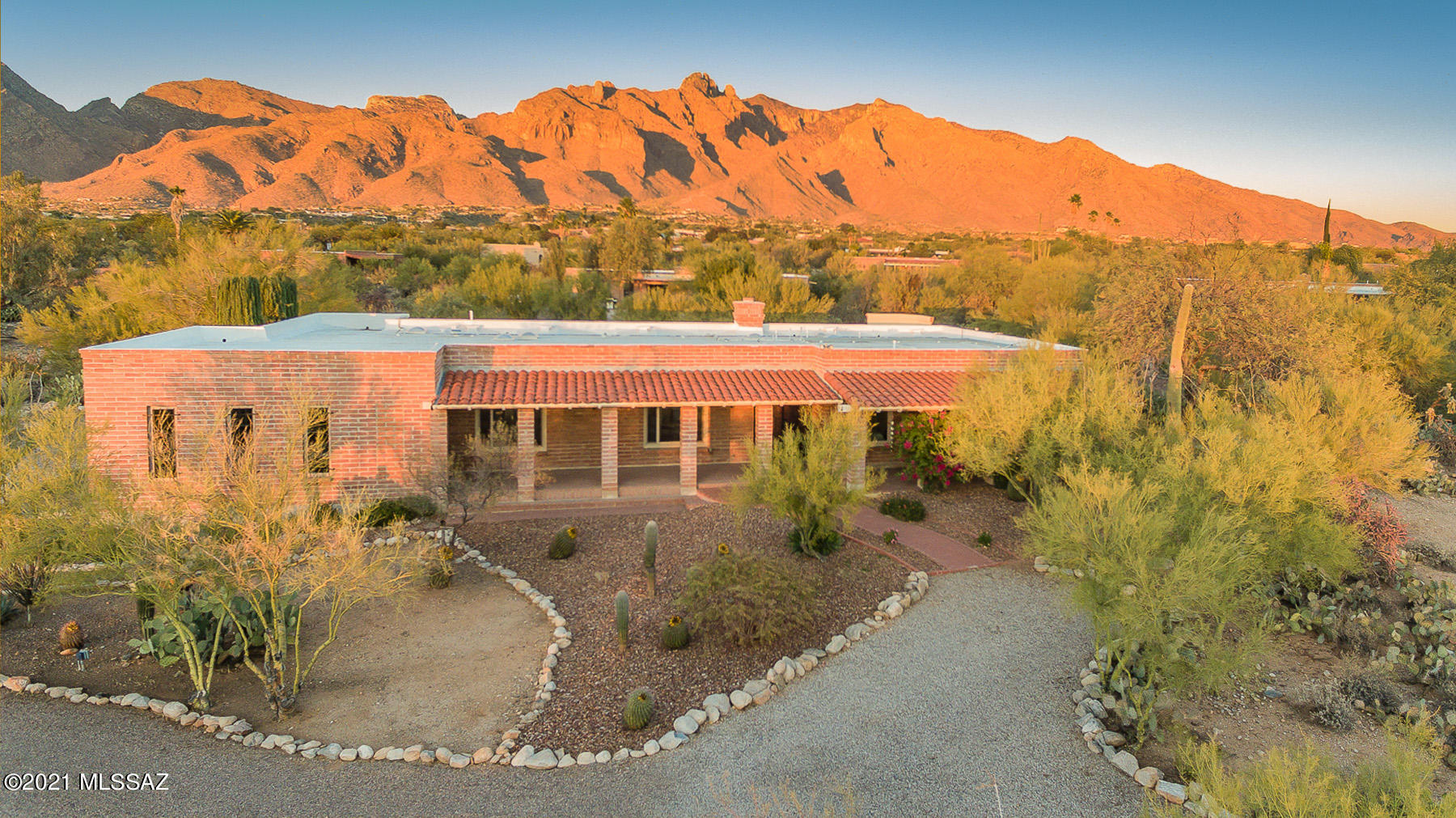 Yes, this is the real ''Tucson Lifestyle''. Remodeled & upgraded, classic Territorial Style (burnt adobe) 4 Br/3 Bath (3039 sgft) in Catalina Foothills  on a private, .84 acre lot in a cul de sac. Gorgeous Mt. views from the N facing backyard w/pool & spa (new equipment) & covered rear patio w/ new, gas barbeque.  Remodeled kitchen w/ custom cabinets (natural Maple), new appliances: new subzero refrigerator/freezer, GE Profile Appliances (3 ovens, warmer), wine cooler;  granite topped island. See separate list for all recent upgrades & additions. Great location & access to roads, just south of the La Encantada outdoor mall & surrounding restaurants/shopping/galleries, hiking trails. Enjoy the inspiring sunset glow on the Catalina Mtns. Floor plan under photos & virtual tour.