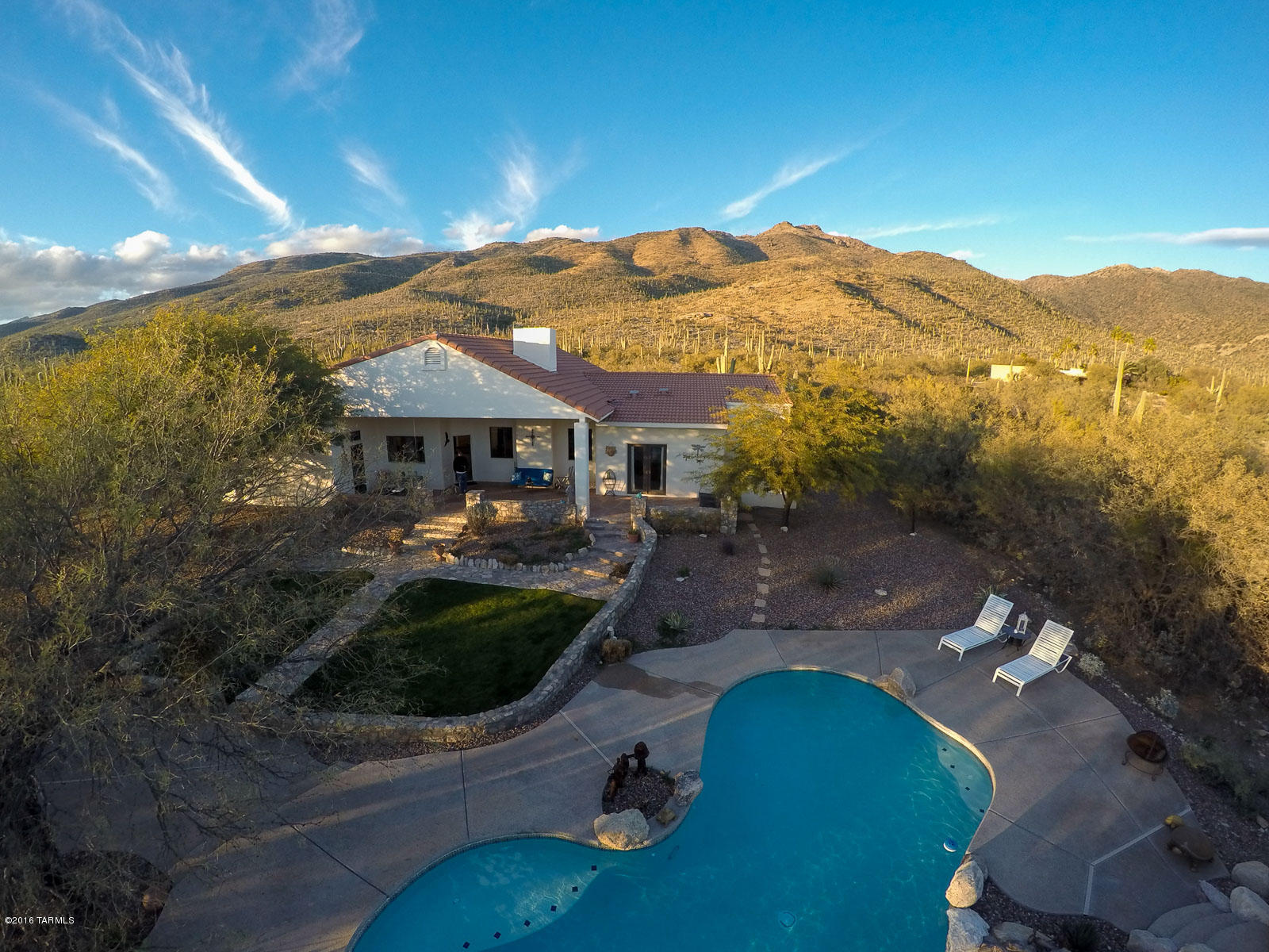 Incredible NE foothills property on 3.33 acres with majestic Catalina Mt and Rincon Mt views and plenty of room for horses. Very private desert oasis surrounded by the mountains and saguaro above the city; rural yet close to everything you would need. Ride your horse into the foothills or ride your bike up Catalina Hwy. This home is custom built with vega beams, tonque & grooved ceiling and scored/stained concrete floors through the main living area. Oversized 3 car garage + extended workshop and huge storage area. Beautiful back yard with pool/spa, extended pool decking, flagstone patio, small grass area and surrounded by mature trees and landscaping. Solid & efficient RASTRA ICF Blocks construction. (Insulated  Concrete Forms) see www.rastra.com for additional information.