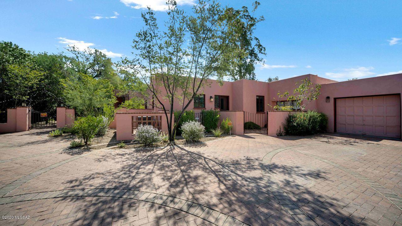 Classic home designed by Bailey and McCoy Builders. Located in Historic El Encanto Estates, a community rich in
local history. This preserved and modernized home has St Charles Kitchen cabinets, sunny breakfast room, vaulted
ceiling, wine storage, steel casement windows, original scored concrete floors. The master bedroom has a private
sitting area with fireplace, library or office and another office plus private laundry. Elegant master bath. En
suite guest quarters with laundry area can be accessed from inside or outside. Double 32860 sq.foot lot with 6 foot
wall, double gate, trees, newer pool, and mature landscaping, perfect for outdoor entertaining. North/south exposure. The driveway can accommodate up to 8 cars. Close to the University of AZ, downtown, restaurants and shopping.