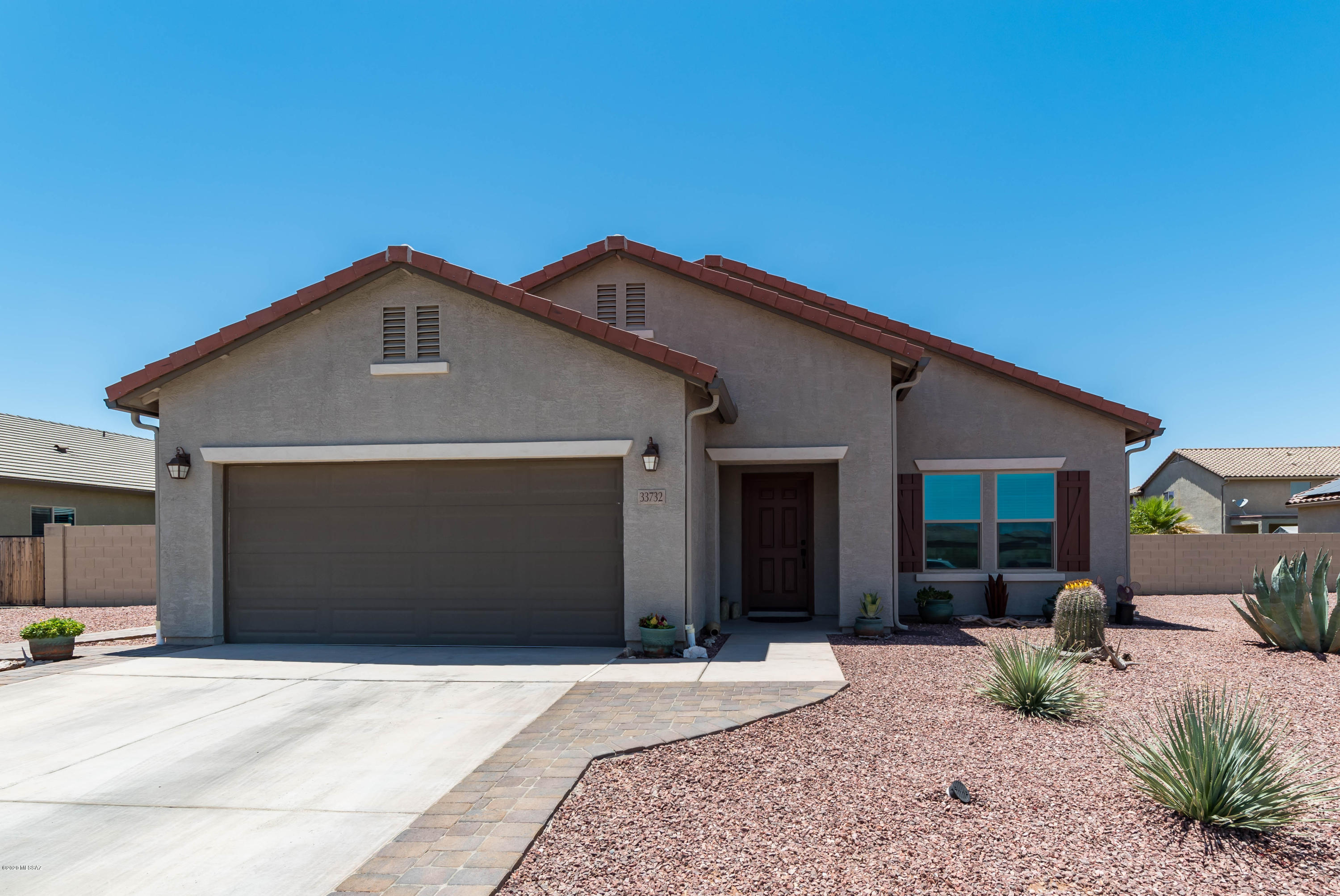 Beautiful Pulte ranch home shows like a model home with custom paint in all rooms. This home is only 2 years old and move-in ready! Lots of upgrades including granite countertops, laminate flooring throughout, new plush carpet in great room, garden tub and separate marble shower in master bath, bay window in master bedroom, 5'' baseboard throughout, Italian ceramic tile in hall bath and laundry room, double French doors on front room, 7 ceilings fans, radiant barrier for efficient heat/cool, 2 inch faux wood blinds throughout. 2 1/2 car garage with stained floor and ceramic tile in shop area, hobby package with extra outlets/overhead lights, walls/ceiling painted to finish. Backyard has covered patio with ceiling fan, paver deck, beautiful flowering landscape and 2 fruit trees.