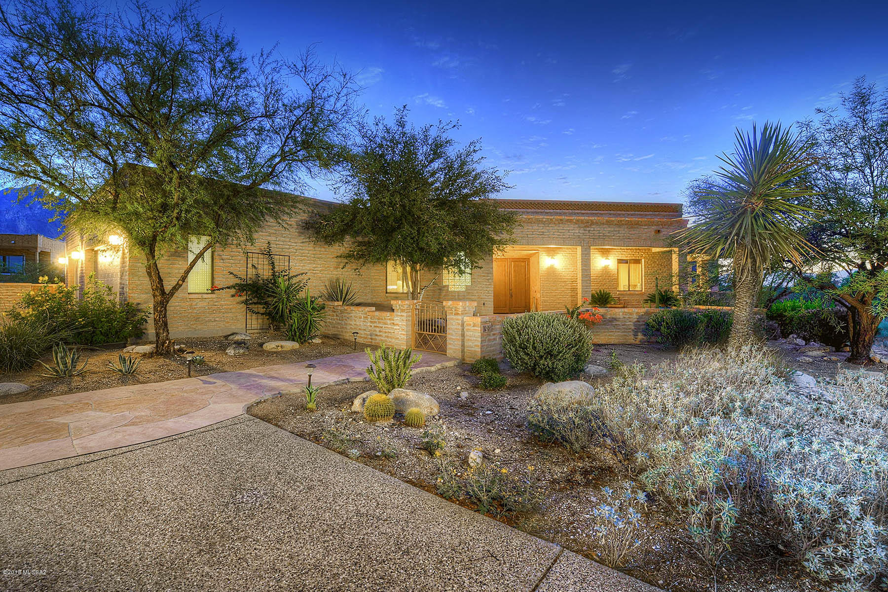 You will be captivated by the gorgeous city & mountain views from this stunning 2003 masonry blt hm featuring travertine tiled flrs, 8' solid alder drs,  entertainer's island kitchen w/granite cntrs, glass/slate backsplashes, raised panel cabs, bar top & lots of windows to soak in the views. Other features incl fabulous grtrm w/stacked stone FP & built-ins, wonderful open flrpln, hi ceilings, huge picture windows, 4 flagstone patios, highly sought after media rm & lush bkyd w/spacious cov'd patio, huge fountain & even more views. Luxurious Mstr Ste w/Ventana stone FP, dual vanities, garden tub, walk-in shower & sitting area that's sure to please. Terrific 3-car gar w/addl storage & wkshp. All on a 1.2 AC cul-de-sac lot situated in a small gated enclave nestled at the base of the fthls.