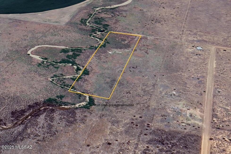 This nearly 10-acre parcel in Pearce, Arizona offers the perfect blend of freedom, function, and natural beauty. Bordering the seasonal Turkey Creek and surrounded by panoramic mountain views, the flat terrain provides an ideal setting for your dream home, homestead, or rural retreat.

Zoned RU-4, this property qualifies for Owner-Builder Opt-Out Permitting, giving you more flexibility and control over your building process. Manufactured and site-built homes are allowed. A shed is already on site, and a septic system is installed, saving you time and upfront costs.

Seller is willing to offer owner financing with a minimum 20% down payment, 6% interest, and a term not to exceed 5 years—a great option for buyers looking to secure land without traditional financing.