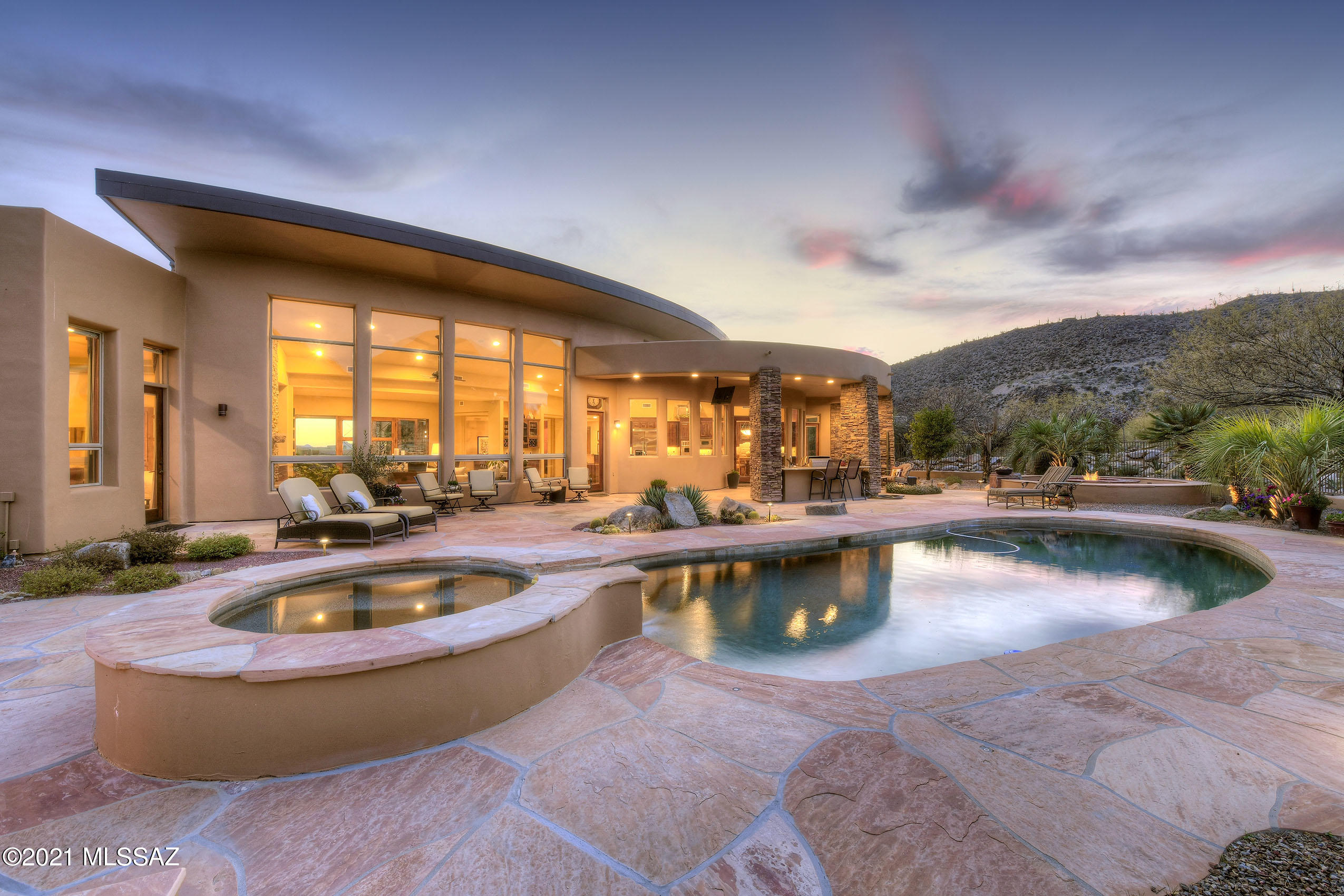 SOPHISTICATED ESTATE HIDDEN IN TOROTLITA FOOTHILLS ...NESTLED ON ''5TH FAIRWAY'' OF GALLERY NORTH COURSE!
THOUGHTFULLY CRAFTED W/FINE APPOINTMENTS & MODERN ARCHITECTURAL DESIGN- CURVED WALLS, INTERESTING CEILING DETAILS, WALLS OF WINDOWS...CREATE A SENSE OF GRANDEUR! GREETED BY WELCOMING CTYD, ENTER THE HEART OF THE HM-*GATHERING ROOM*, BOASTS SOARING CEILINGS, STONE FP, FLR TO CEILING WINDOWS BRING IN ''SONORAN DESERT'' & BREATHTAKING MTN VIEWS! CHEFS DREAM KIT-ALL PROFESSIONAL APPLIC, TONS OF GRANITE CTRS/CABINTRY, PREP SINK, CURVED ISLANDS/& BAR -EVEN A COMPUTER DESK!
FABULOUS SPLIT FLRPLN-ALL BR EN-SUITES INCLS 2 MASTER SUITES +LIBRARY/4TH BR 
RESORT BKYD-HEATED POOL/SPA, ALFRESCO KIT/BBQ,CHAT AREA W/FP! AMAZING VIEWS ON ROOF DECK-PANORAMIC MTN RANGES, LUSH FAIRWAYS CITY LTS/SUNSETS