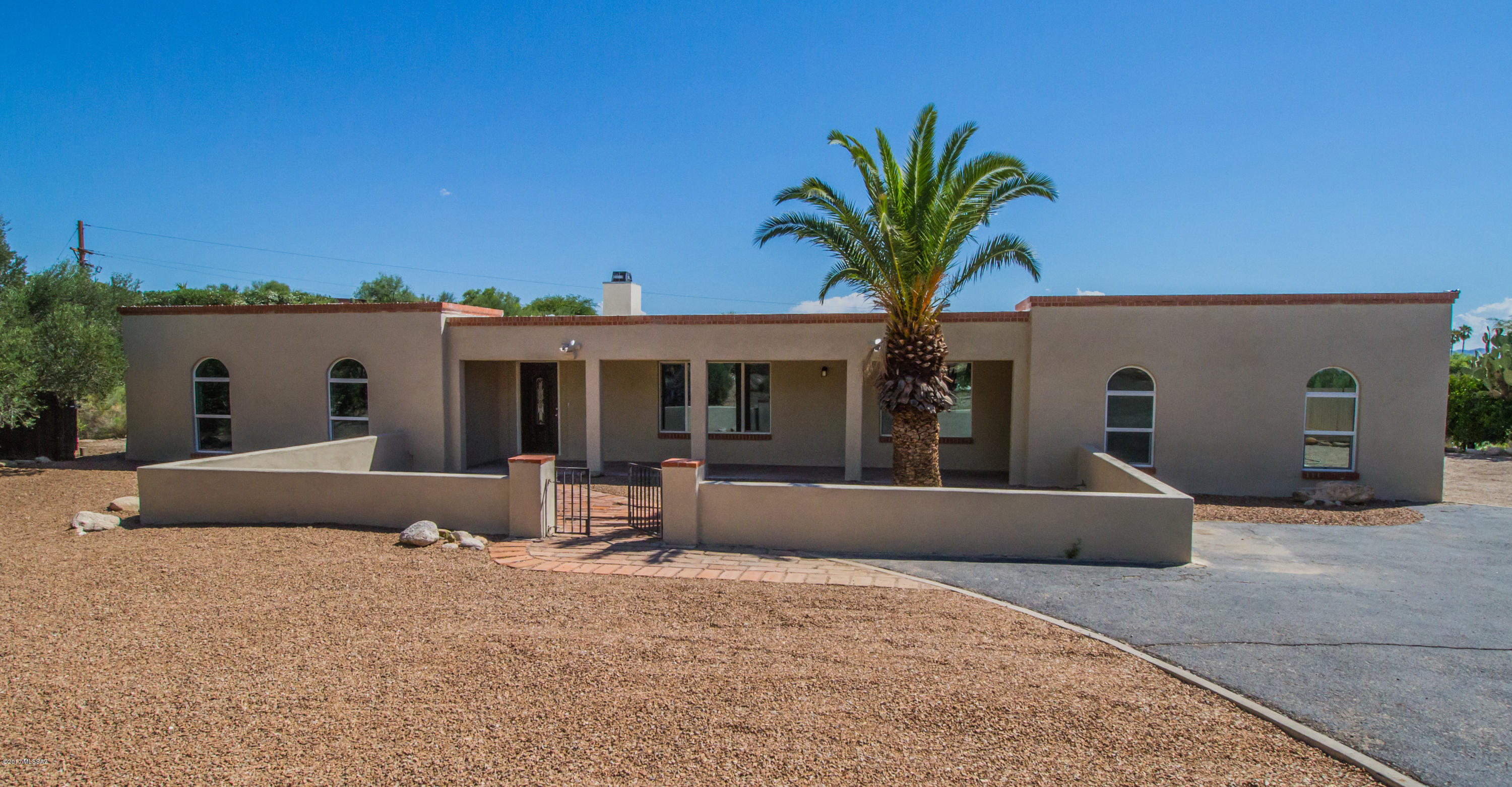 Stunning move-in ready home on over an acre with an abundance of upgrades! Neutral interior palette, beautiful wood ''look'' tile throughout, spacious and open floorplan, plus lots of natural light! Gourmet kitchen boasts custom cabinetry, granite countertops, stainless steel appliances, and more! Huge great room at the front of the home, plus family room with built-in shelving! All bedrooms boast new carpeting. Relax and unwind in the huge master suite with private patio access. All three bathrooms feature stylish tile surround showers, granite counters, and upgraded fixtures. Soak up the Arizona sunshine and mountain views in the ultimate backyard oasis, complete with sparkling pool! The perfect home for entertaining, inside and out