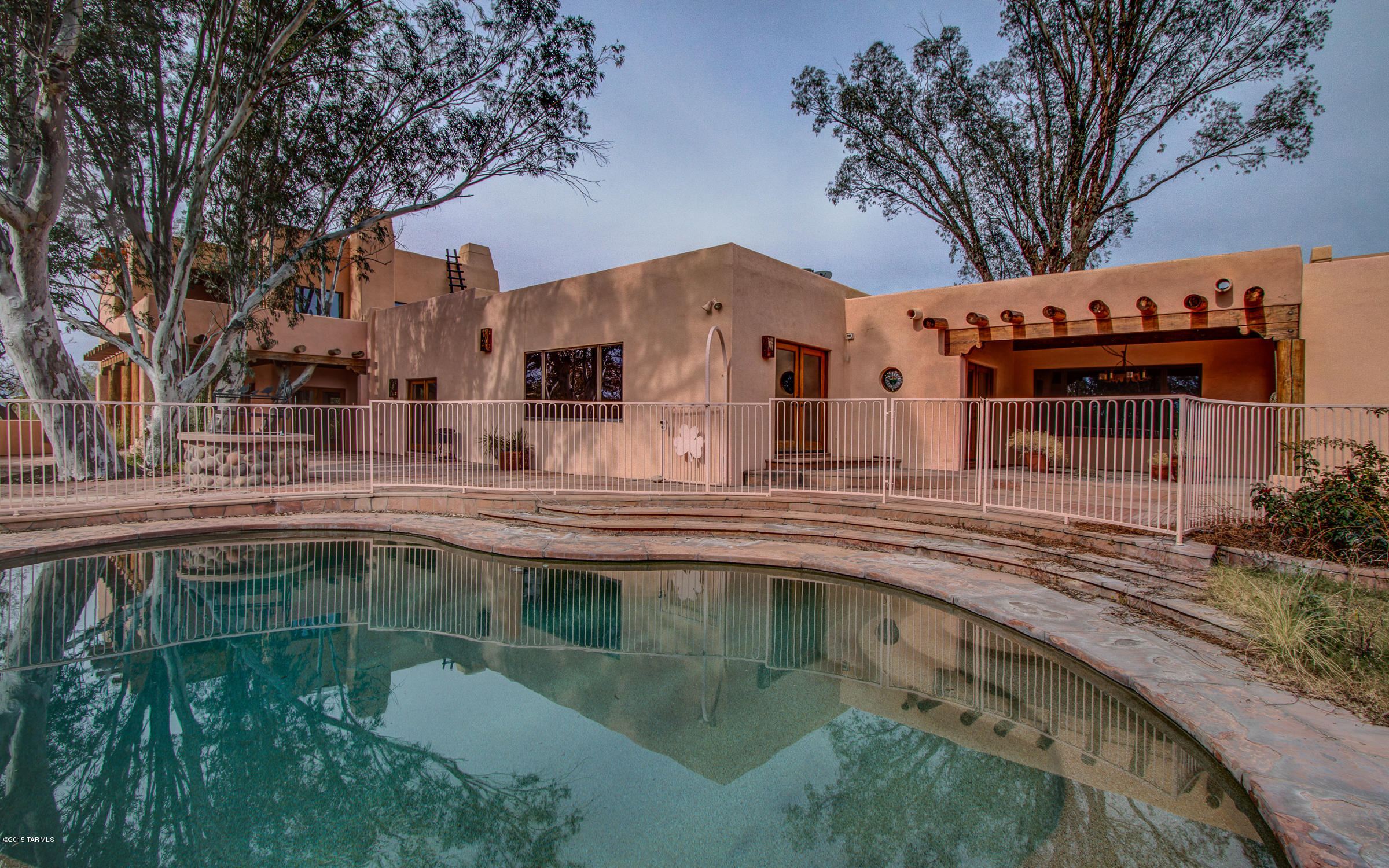 NOT LOCATED ON ORACLE! Great Sante Fe Home And Even Better NW Value! Over 4000sf Home With Guest House On Almost 5 Acres In Town! Features Include Flagstone Courtyard Entry, Tennis/Basketball Court, Mini Soccer Field, Pool/Spa-Rock Waterfall, Slide, BBQ, Putting & Chipping Greens & Lush Landscaping (watered from the well). Priced To Sell Schedule Your Showing Today!

**The house sits on parcel #105-05-0100 (2.22 acres approx.) & vacant land parcel #105-05-0110 (2.56 acres approx.). Both convey with sale. **