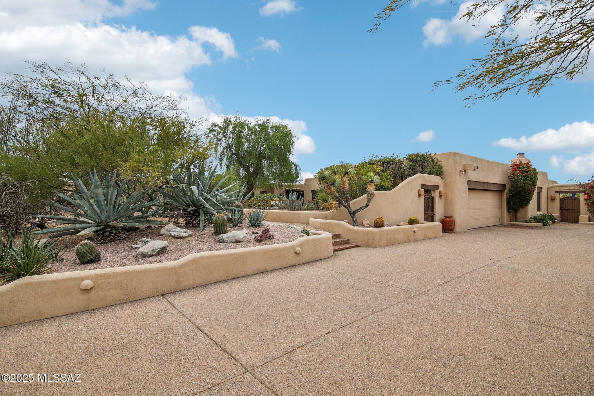 Nestled in the exclusive Sin Vacas community, this stunning 4-bed, 3-bath Southwestern style home offers the perfect blend of desert elegance and modern living. With breathtaking mountain and city views, this home features exposed beams, rustic tile flooring, and large windows that fill the home with natural light. The kitchen boasts granite countertops and high-end appliances, while the primary suite offers a private retreat with a luxurious bath and stunning views. Outdoors, enjoy the sparkling pool and spacious patio, ideal for entertaining or relaxing while soaking in the desert's beauty. Privacy and tranquility await in this exceptional home. Schedule your tour today!