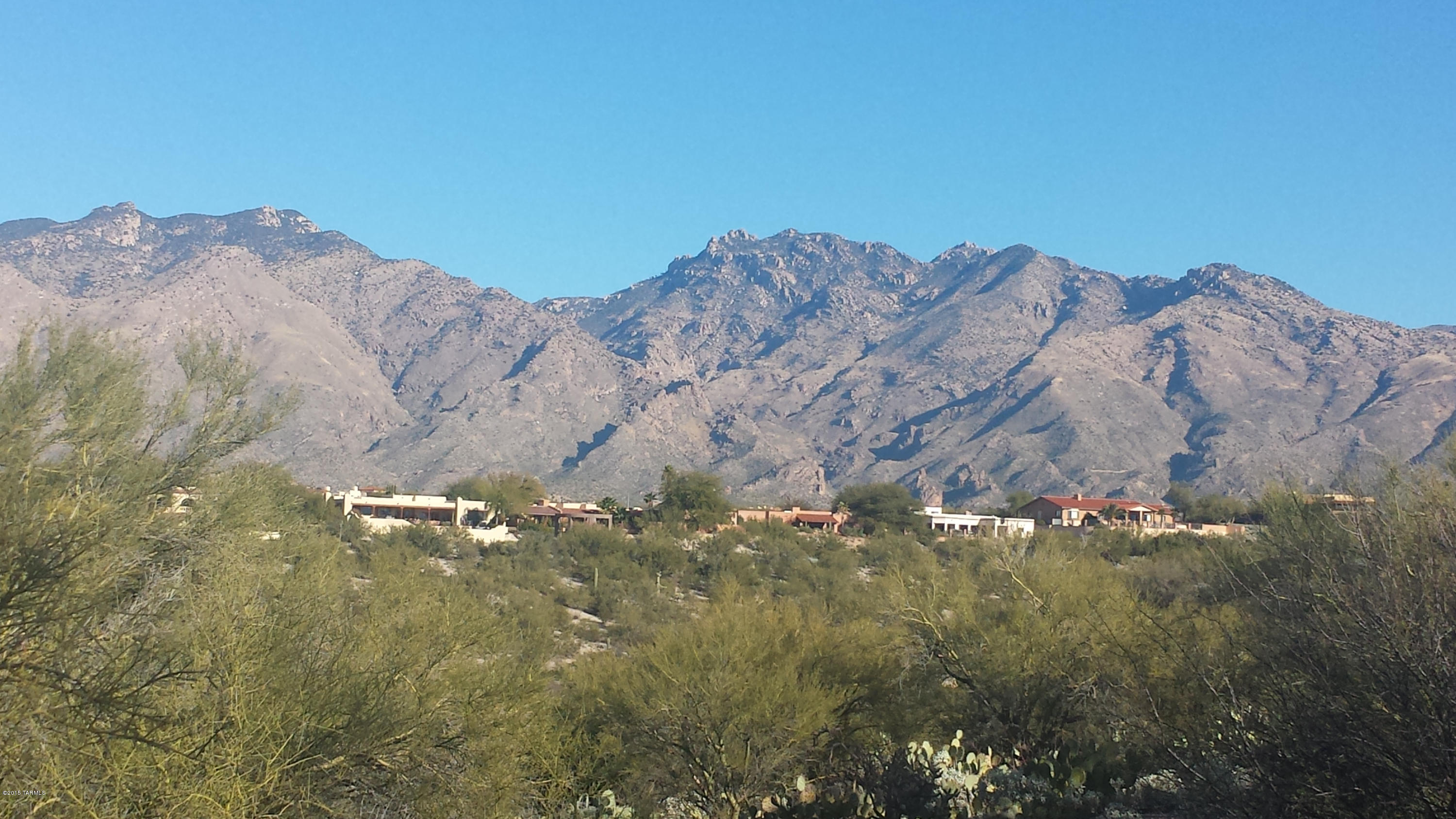 Wow! A level lot with 360 degree views and virtually no obstructions in any direction...and in the heart of the Catalina Foothills. All utilities at lot lines, sewer in road. Architectural plans available from seller at no charge.